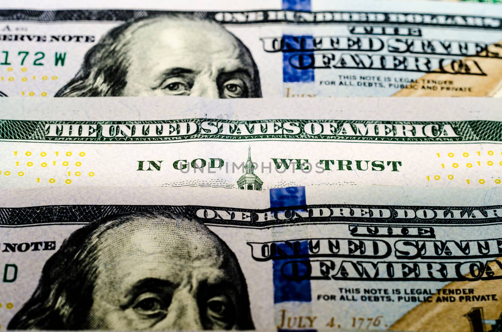 bill hundred US dollars closeup phrase in god we trust