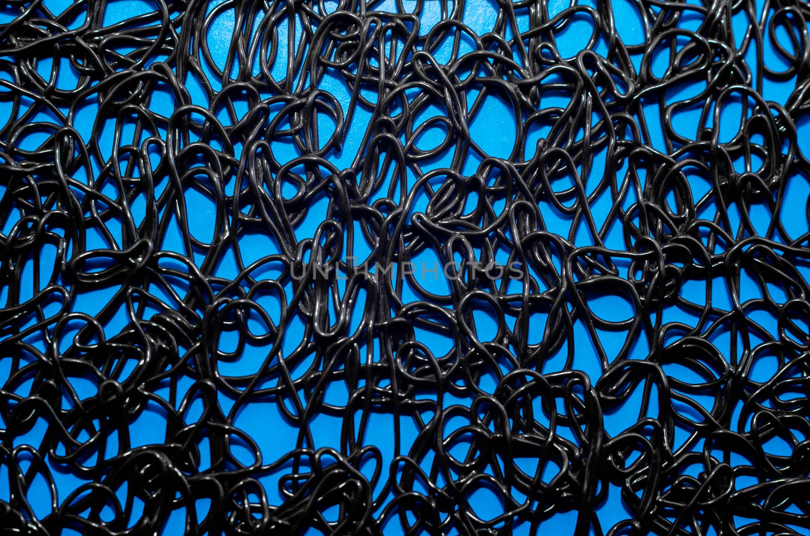 texture pattern of dark brown rubber on a blue background