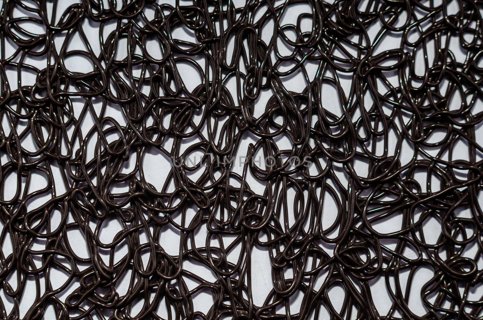 texture pattern of dark brown rubber on a white background