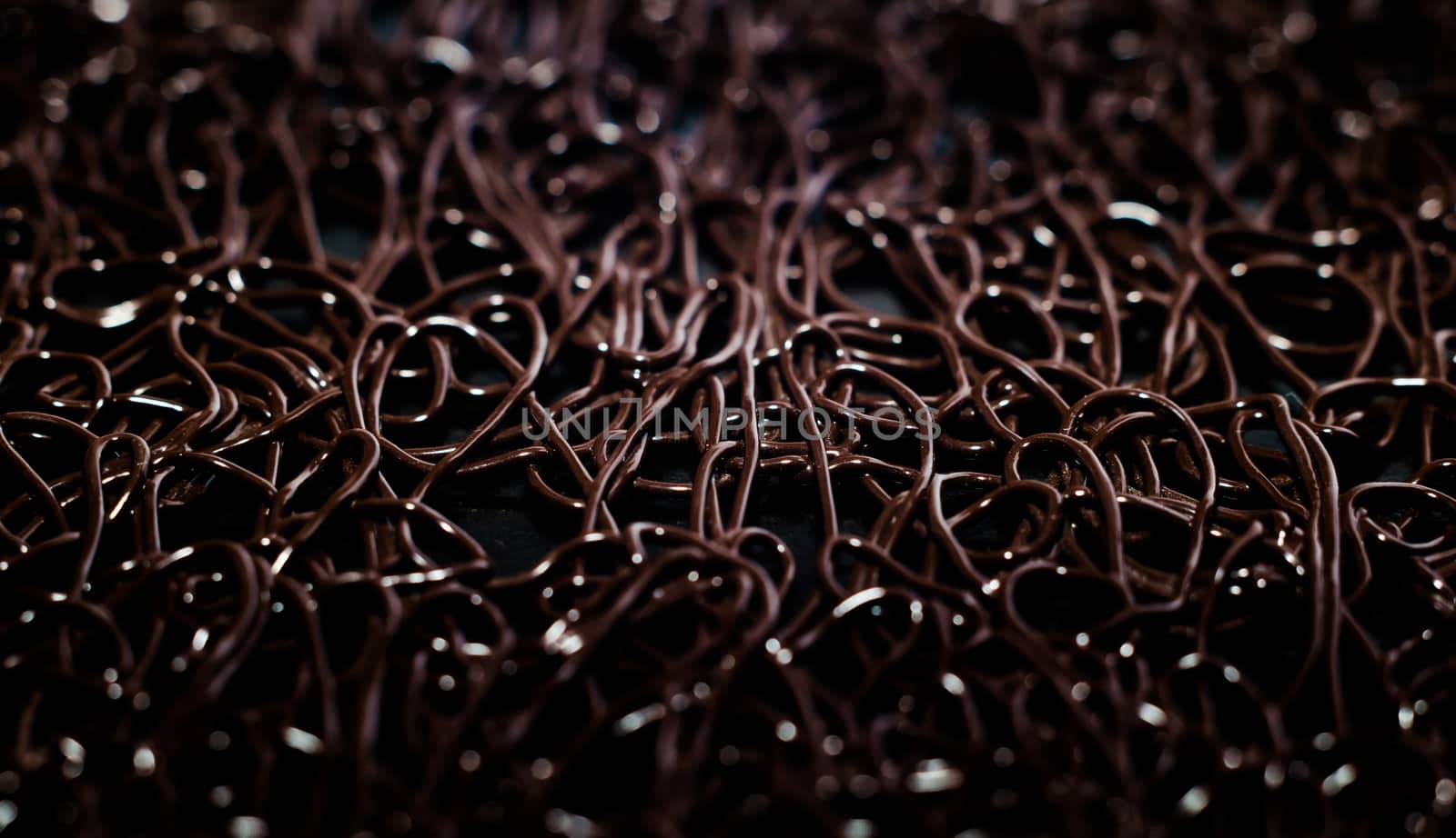 texture pattern of dark brown rubber on a black background