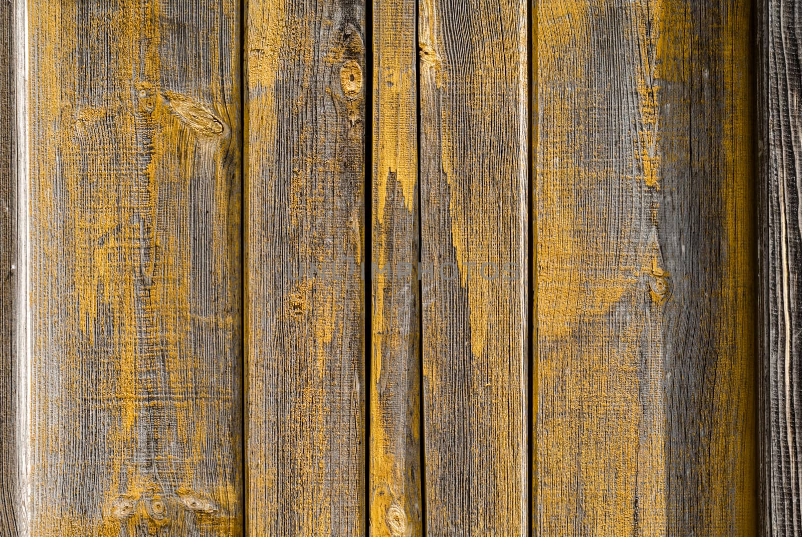 texture wooden boards with traces of yellow paint