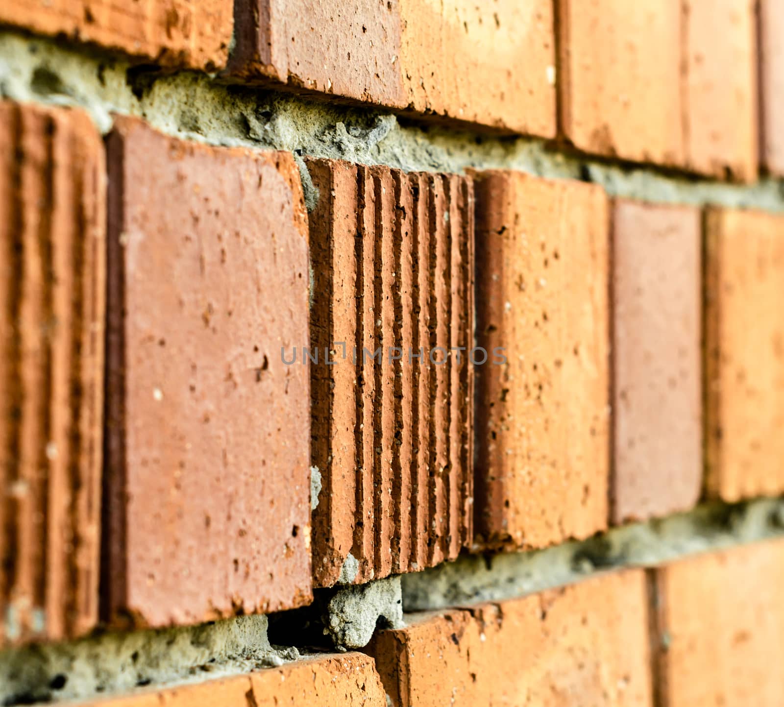 texture of an old orange brick wall closeup