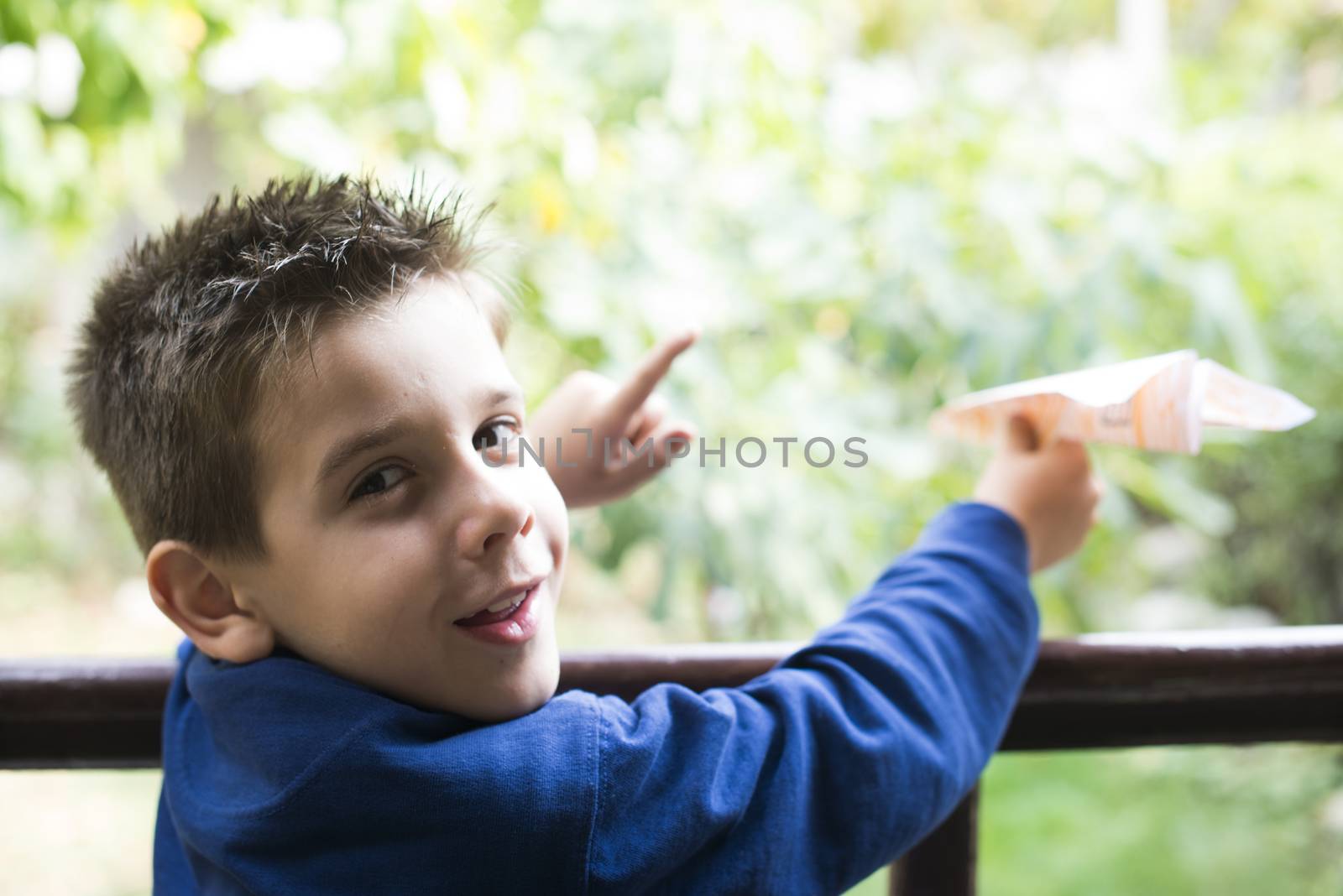 Kid throws paper plane by deyan_georgiev