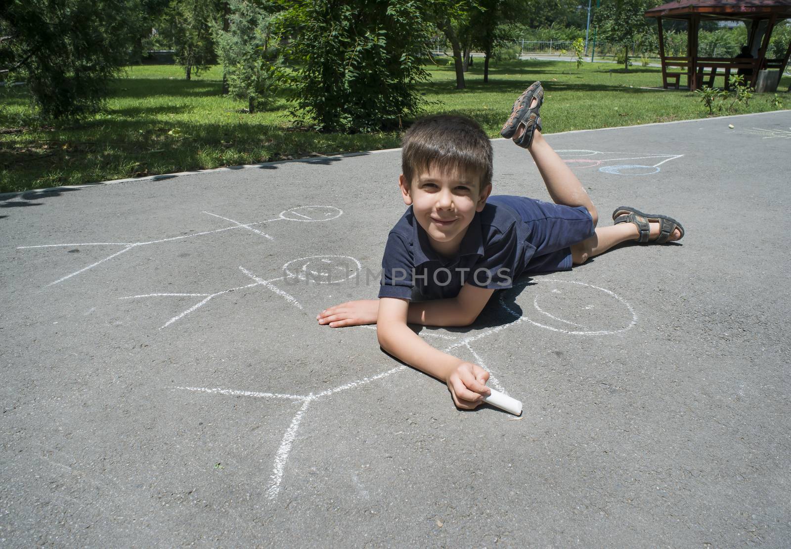 Child drawing family on asphalt by deyan_georgiev