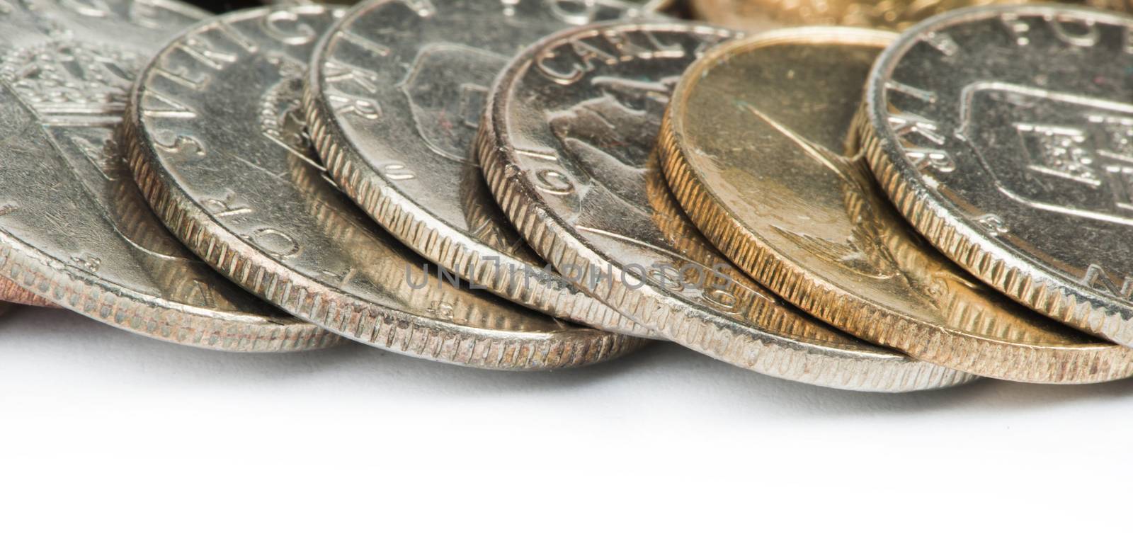 Stacks of coins white isolated studio shot