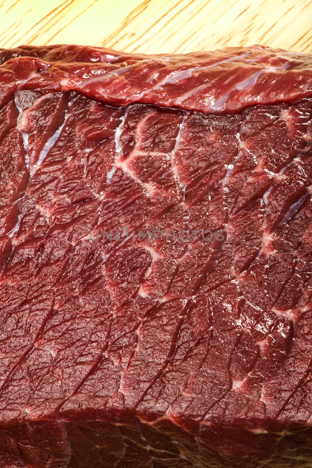 Raw beef steak meat on kitchen board close up