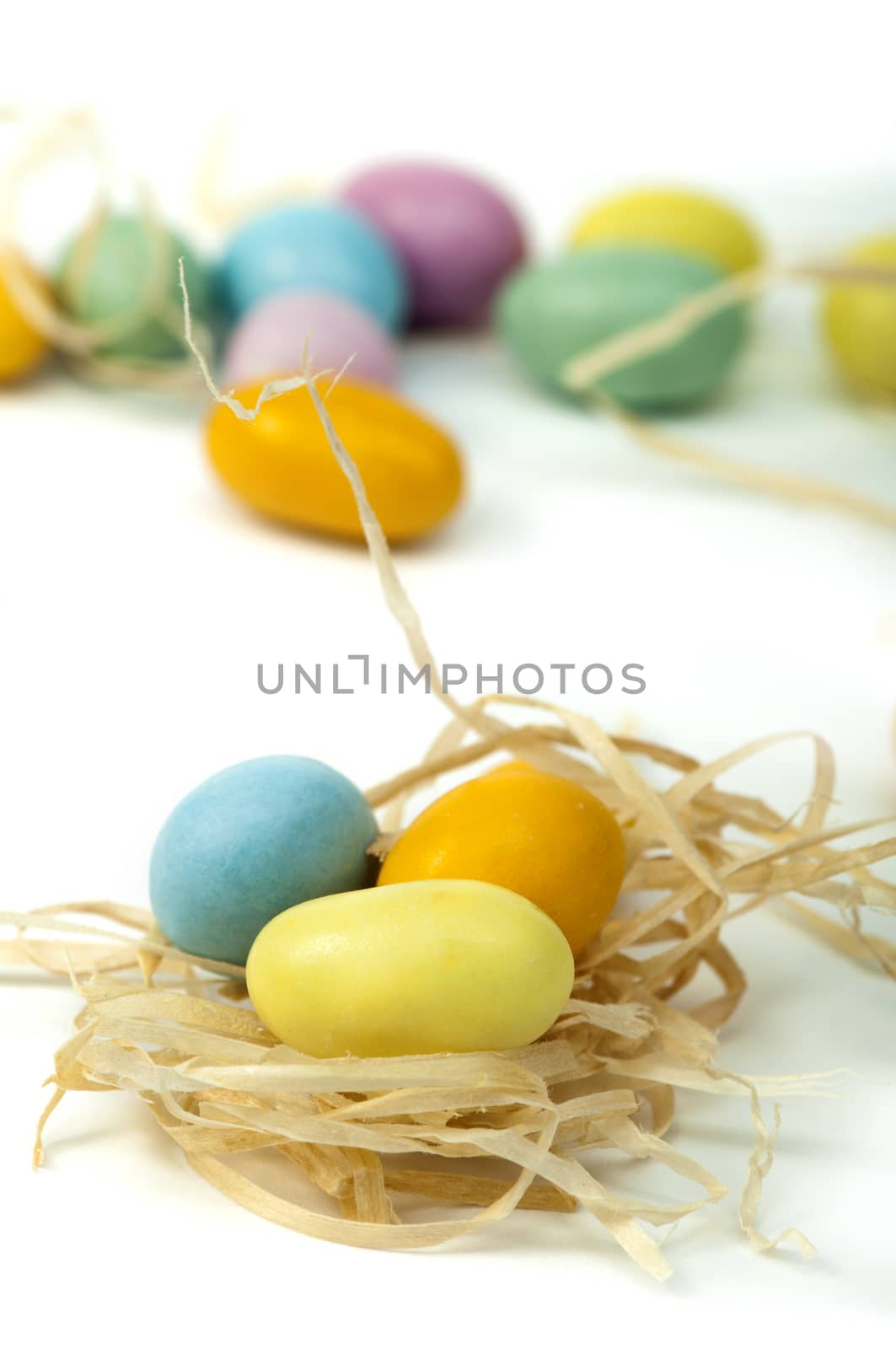 Small multicolored eggs white isolated