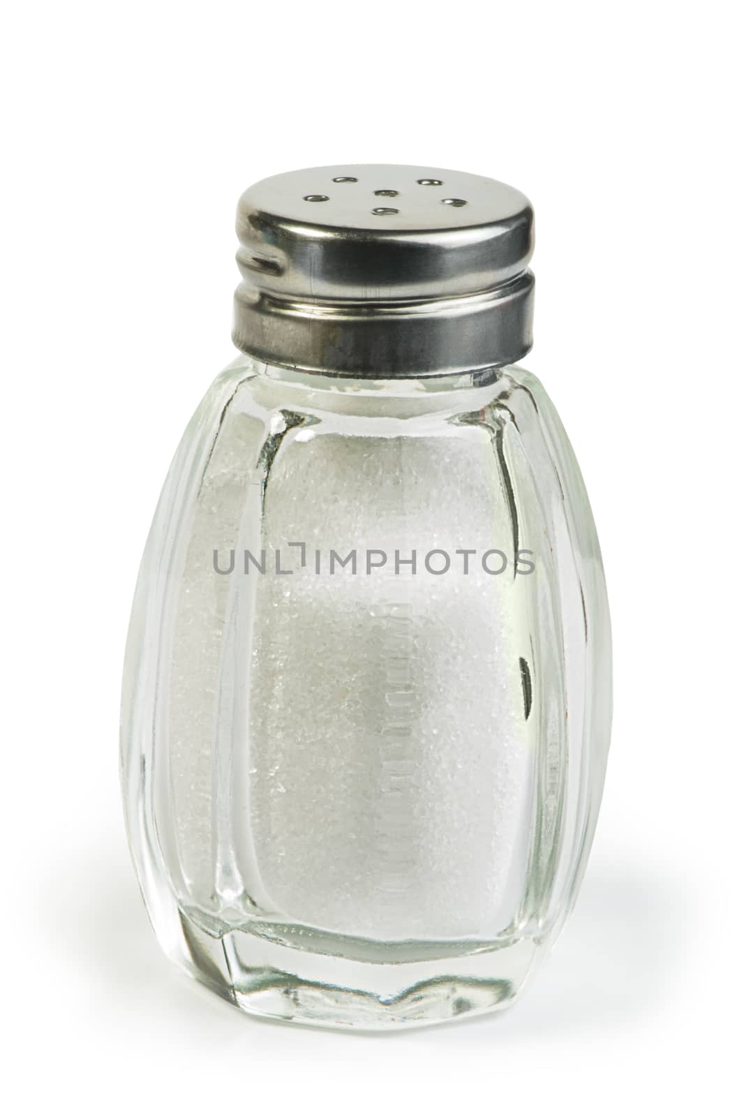 Salt and saltshaker on white background .