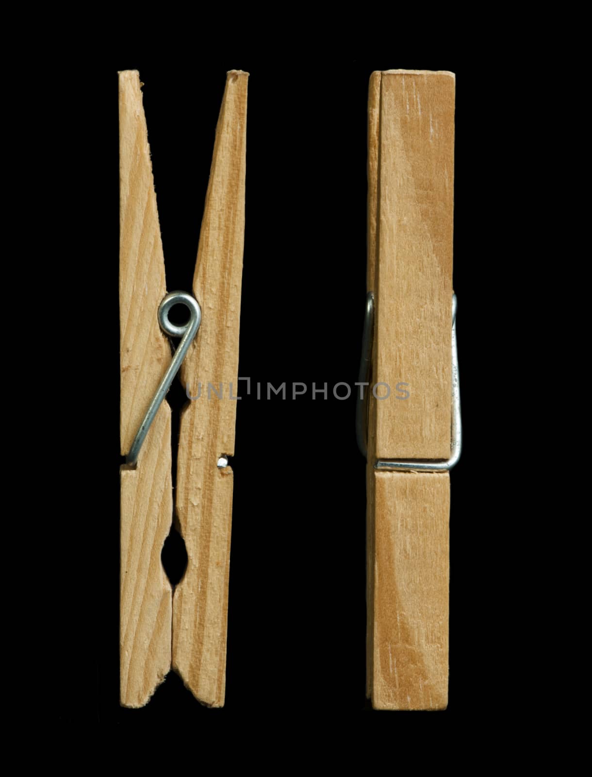 Clothes natural wooden peg. Isolated studio shot