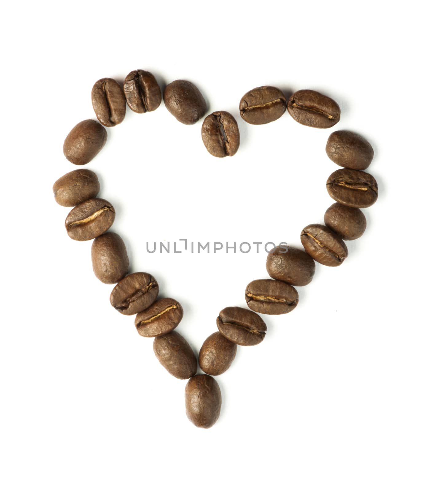 Heart made ​​of coffee beans. White isolated