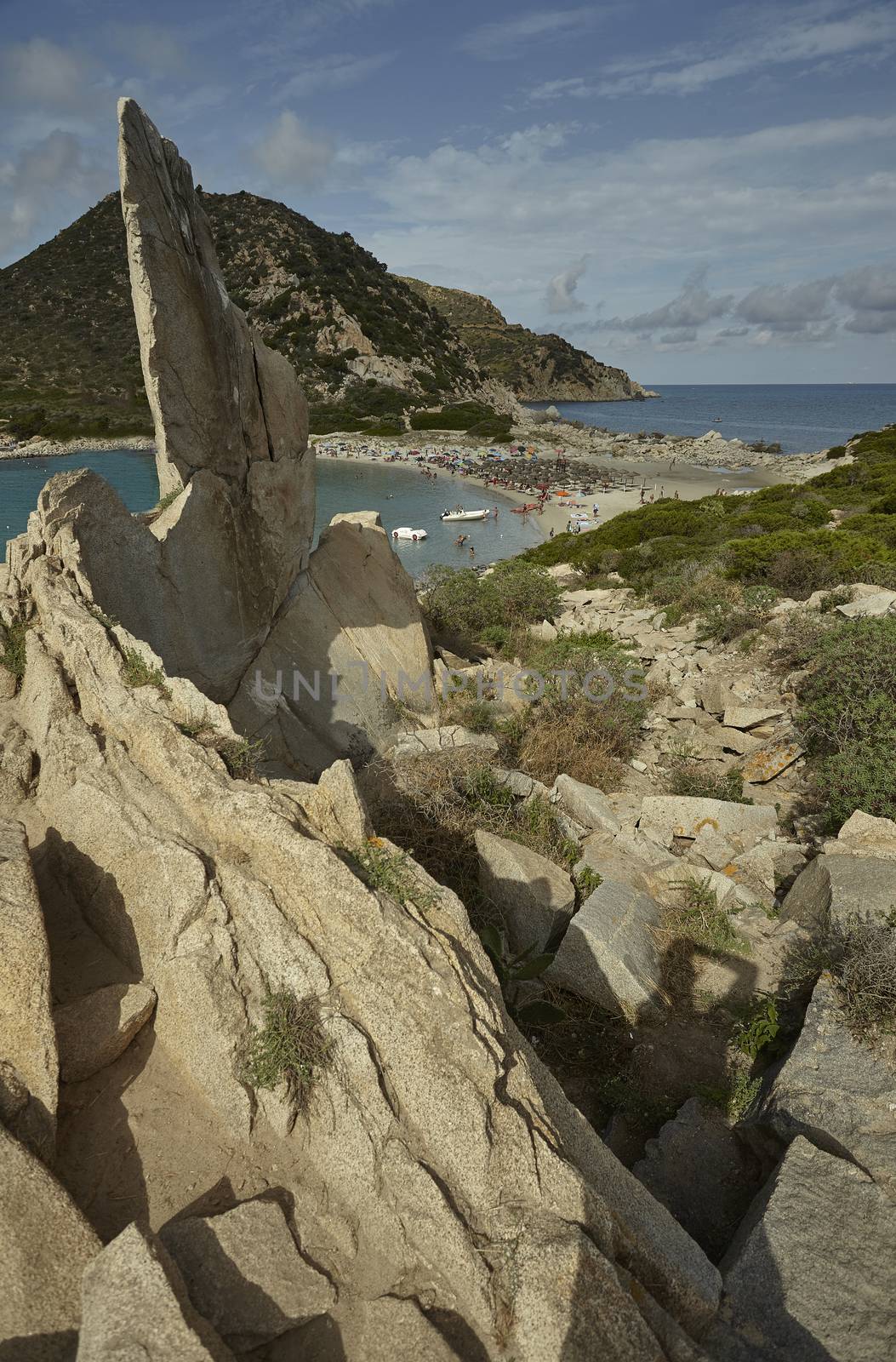 Natural view of the Punta Molentis beach taken from the height of the rocks on the side of the beach. Vertical Shot.