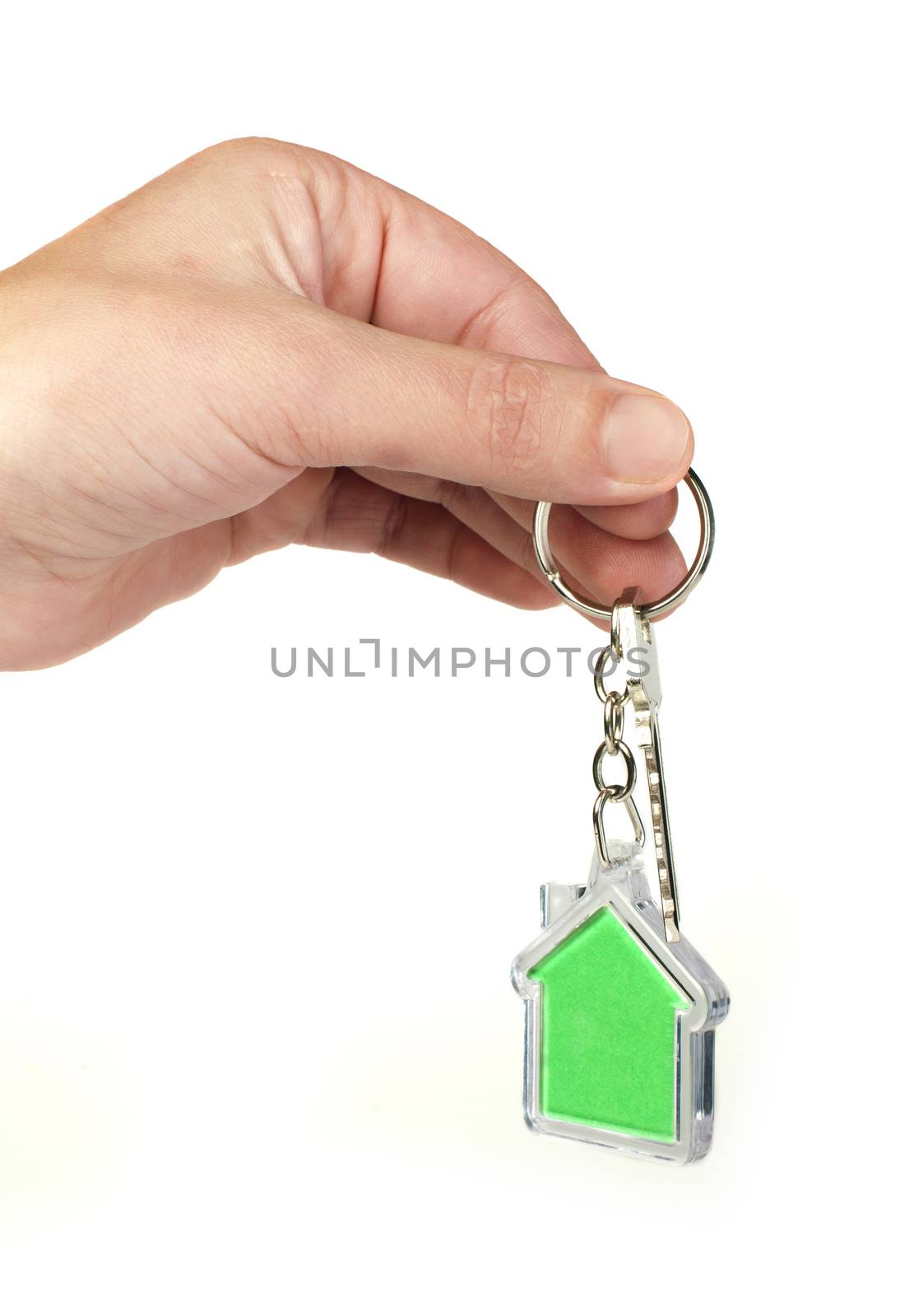 Keychain with figure of green house. Hand holding key and Keychain.