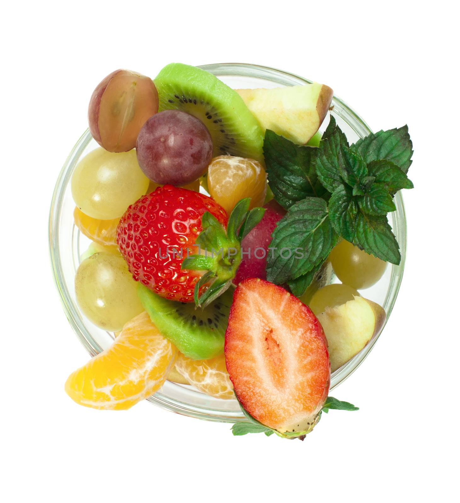 Fruit salad in a glass bowl on white background