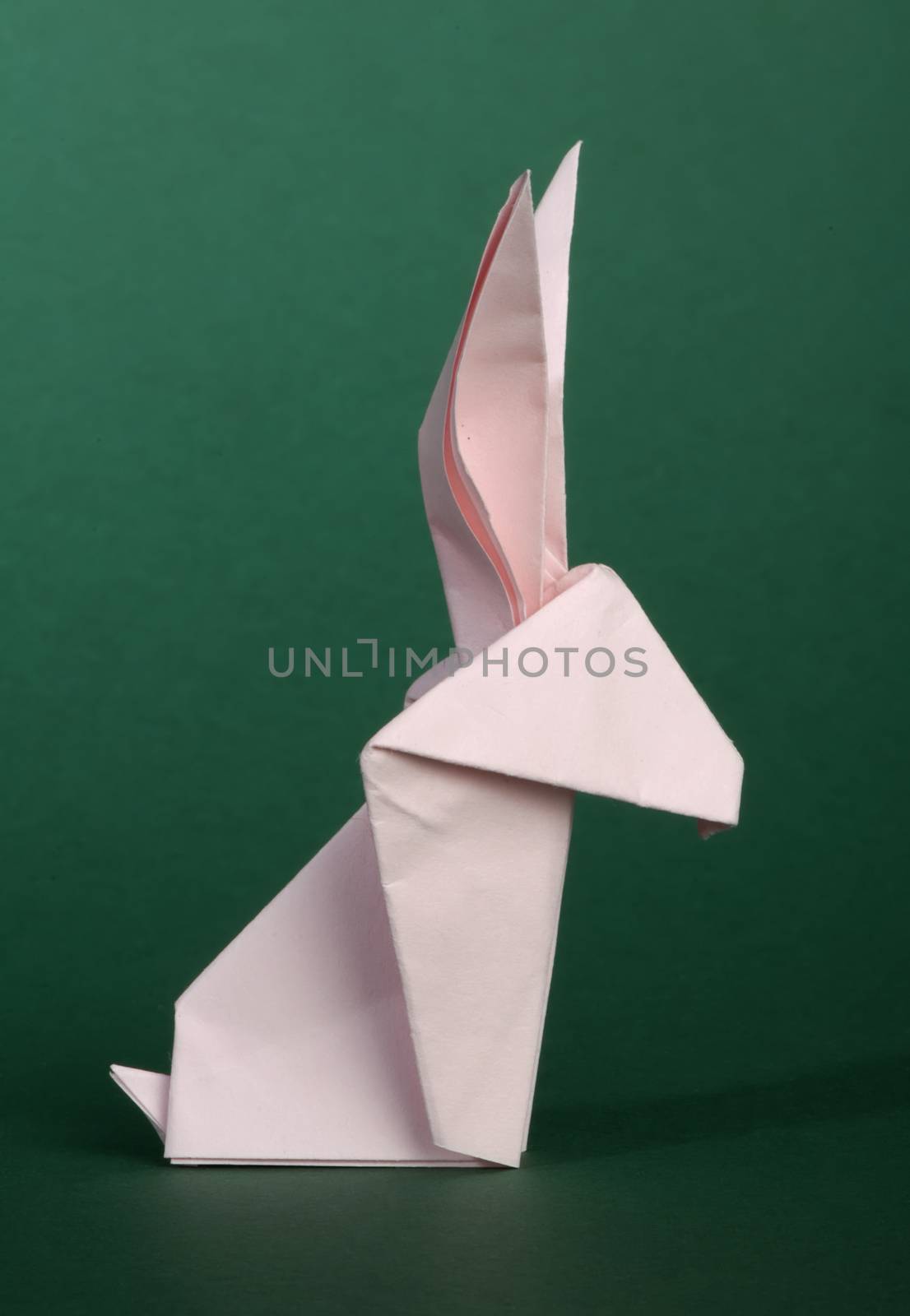 Paper made pink rabbit. 3D folded origami style. 