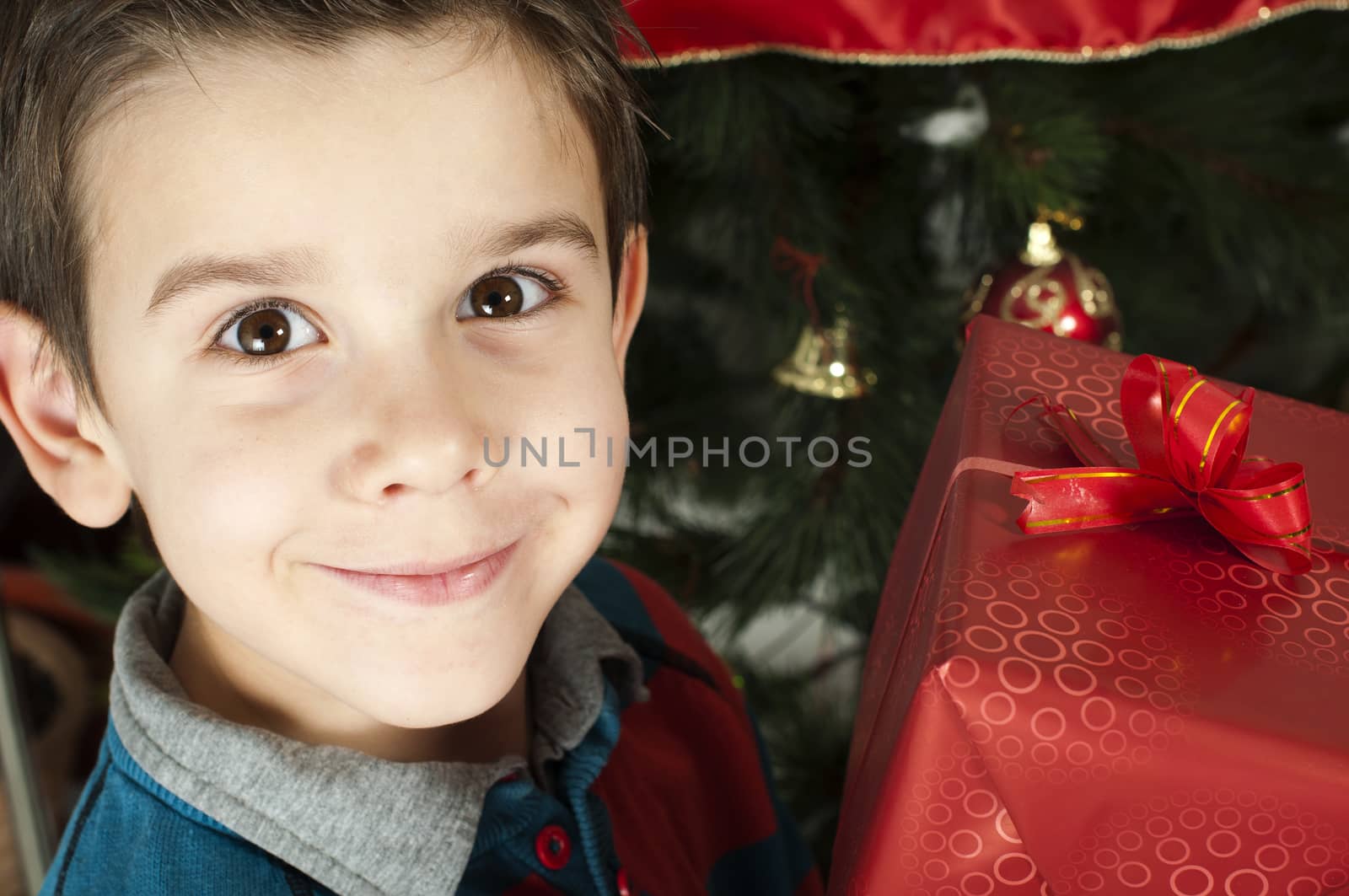 Happy child receive the gift of Christmas by deyan_georgiev