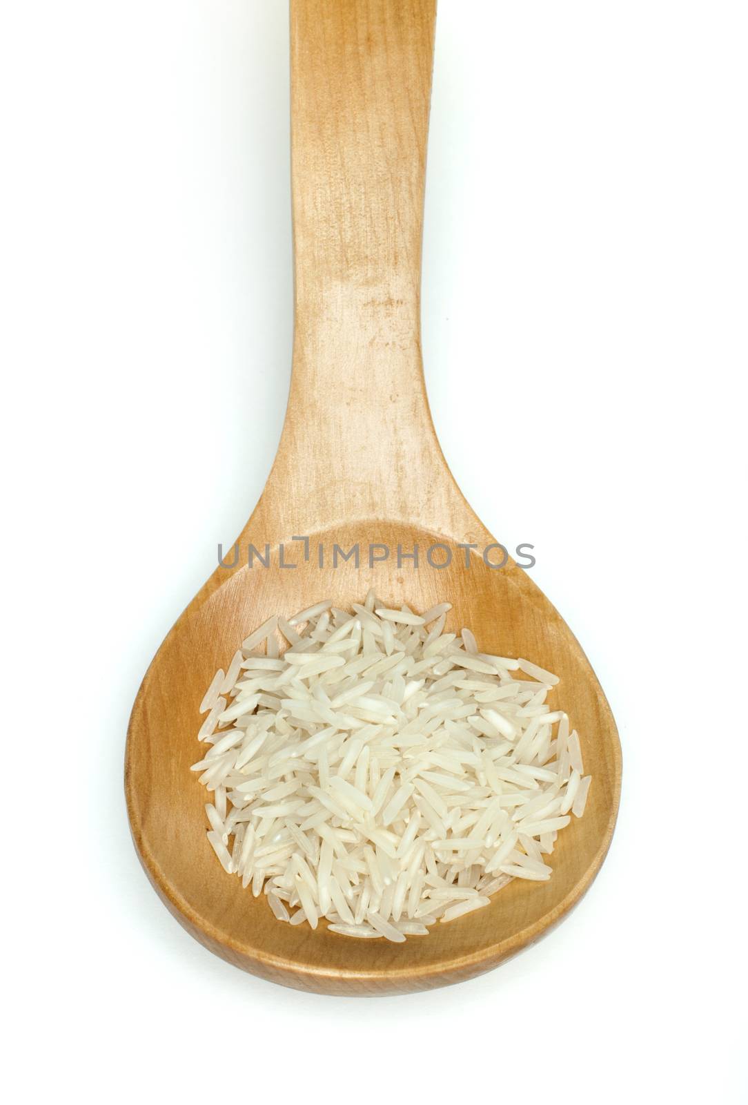 Basmati rice in wooden spoon on white background
