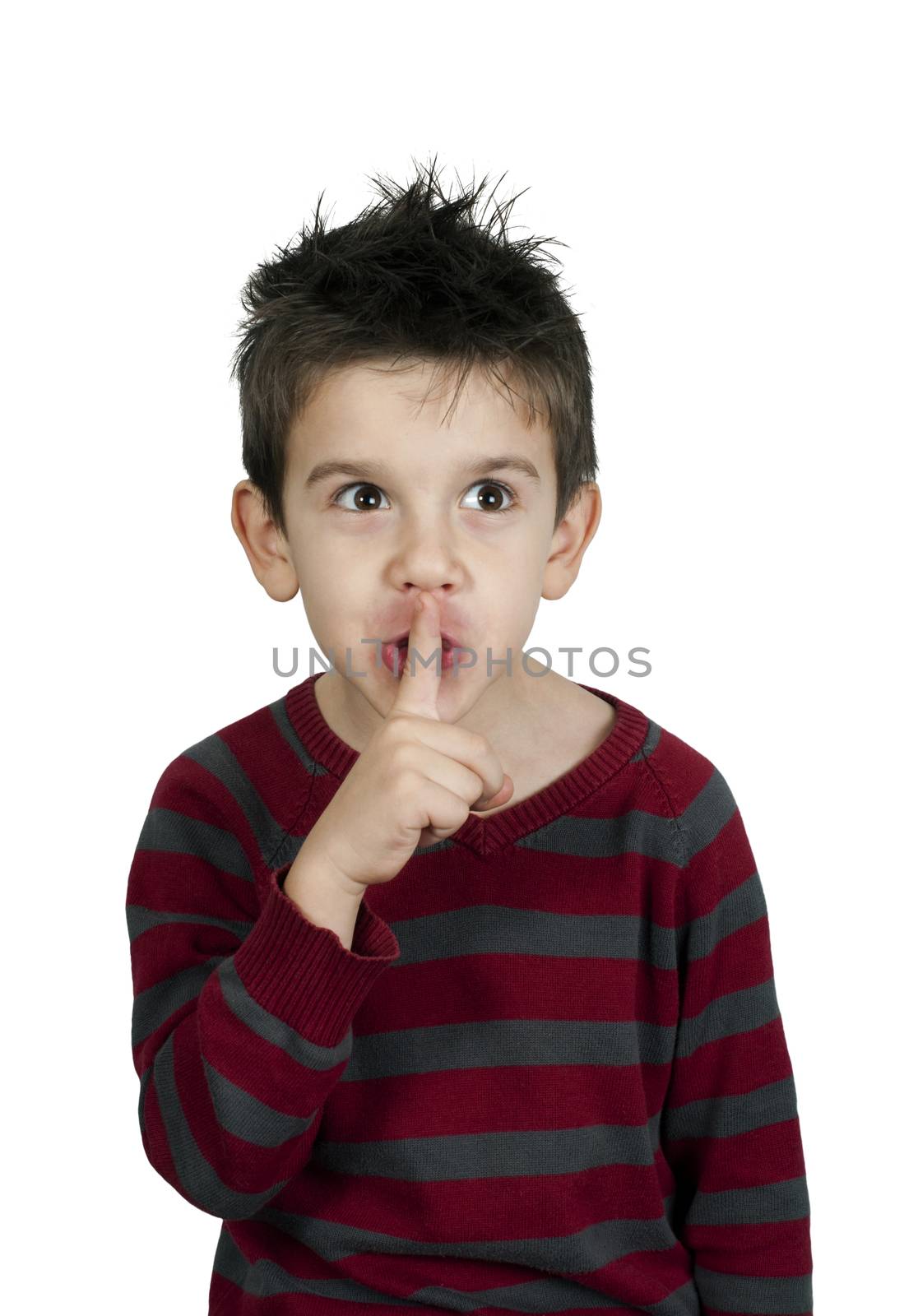 Little boy showing silence symbol