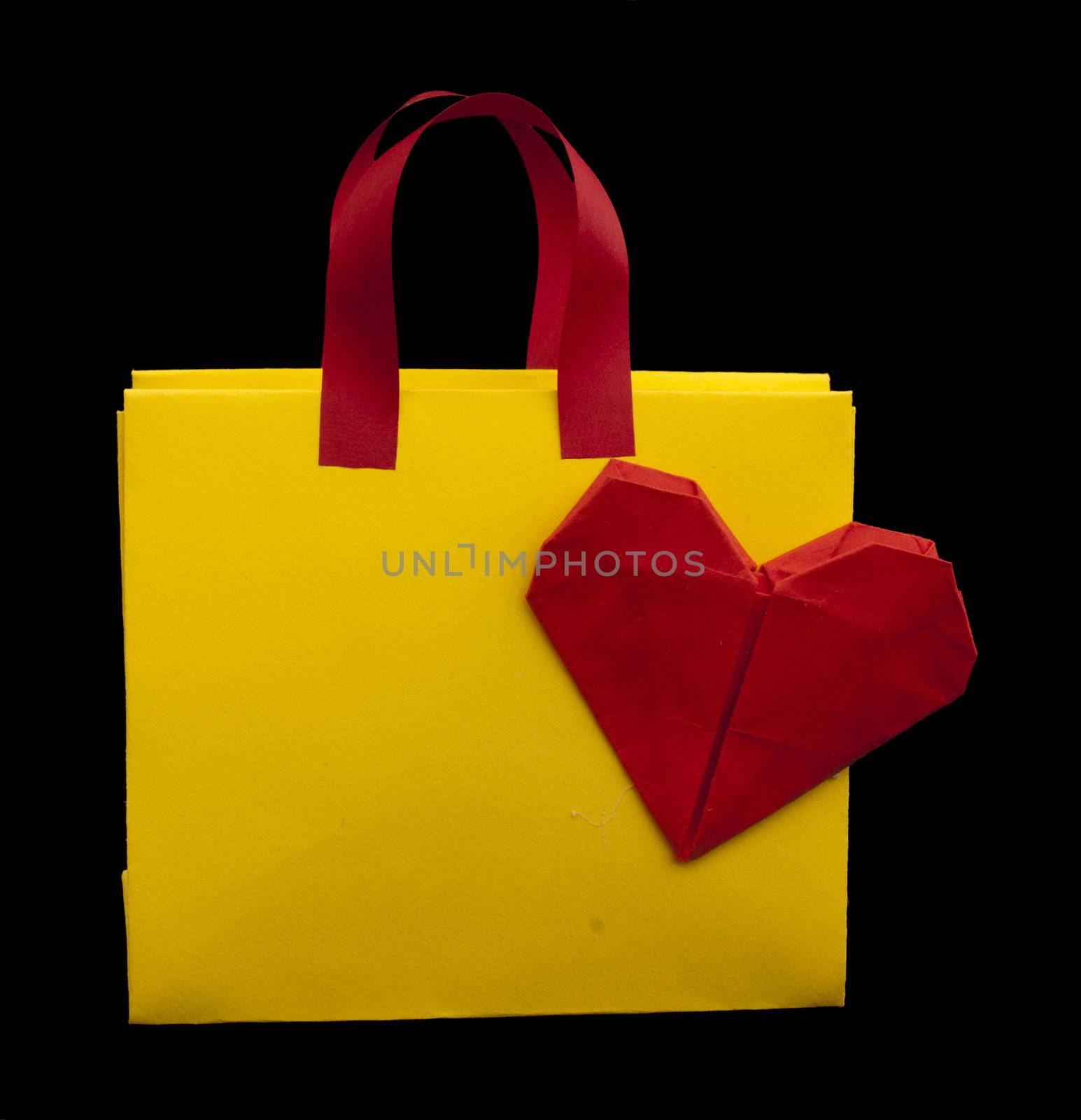 Yellow and red shopping bag with red heart.