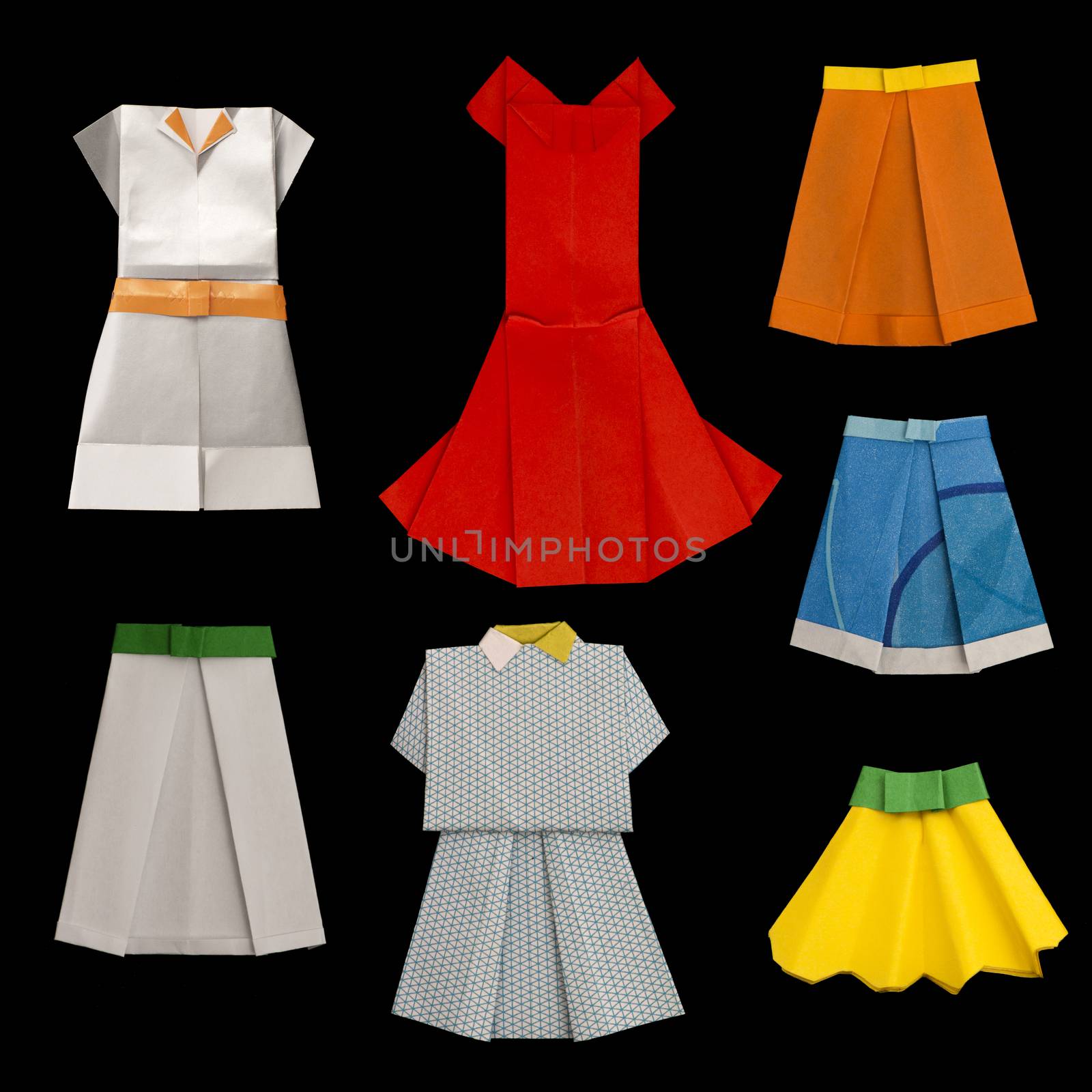 Set of Dresses and Skirts made ​​of paper. Isolated origami