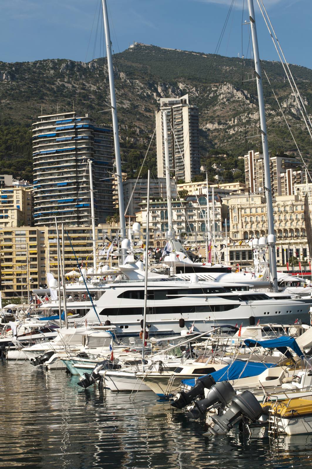 Yachts moored in Monaco. Buildings from Monaco in the background.