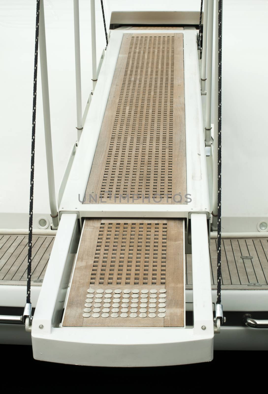 Yacht boarding ladder with rotating platform