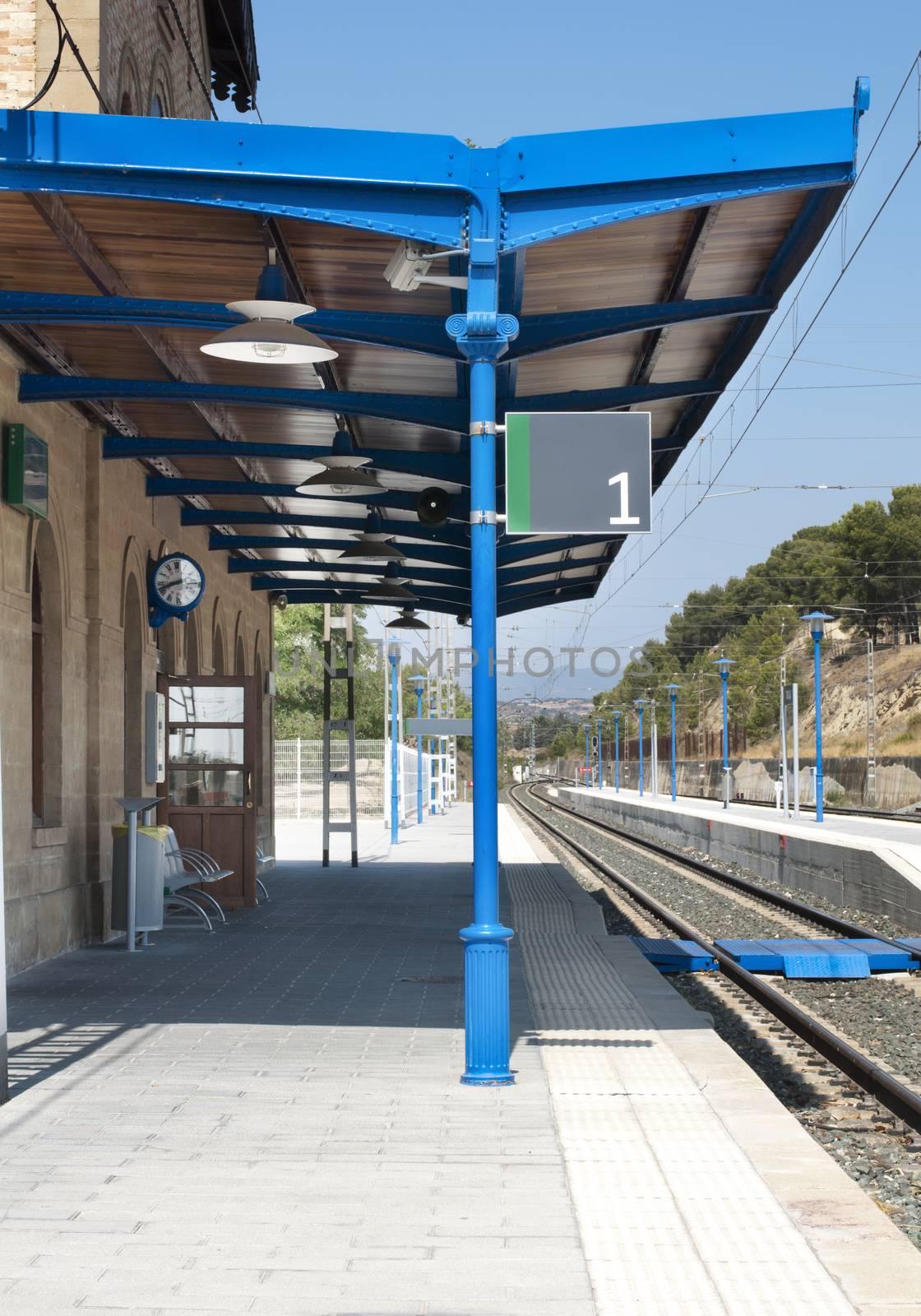 Ancient-style railway station and railroad rails