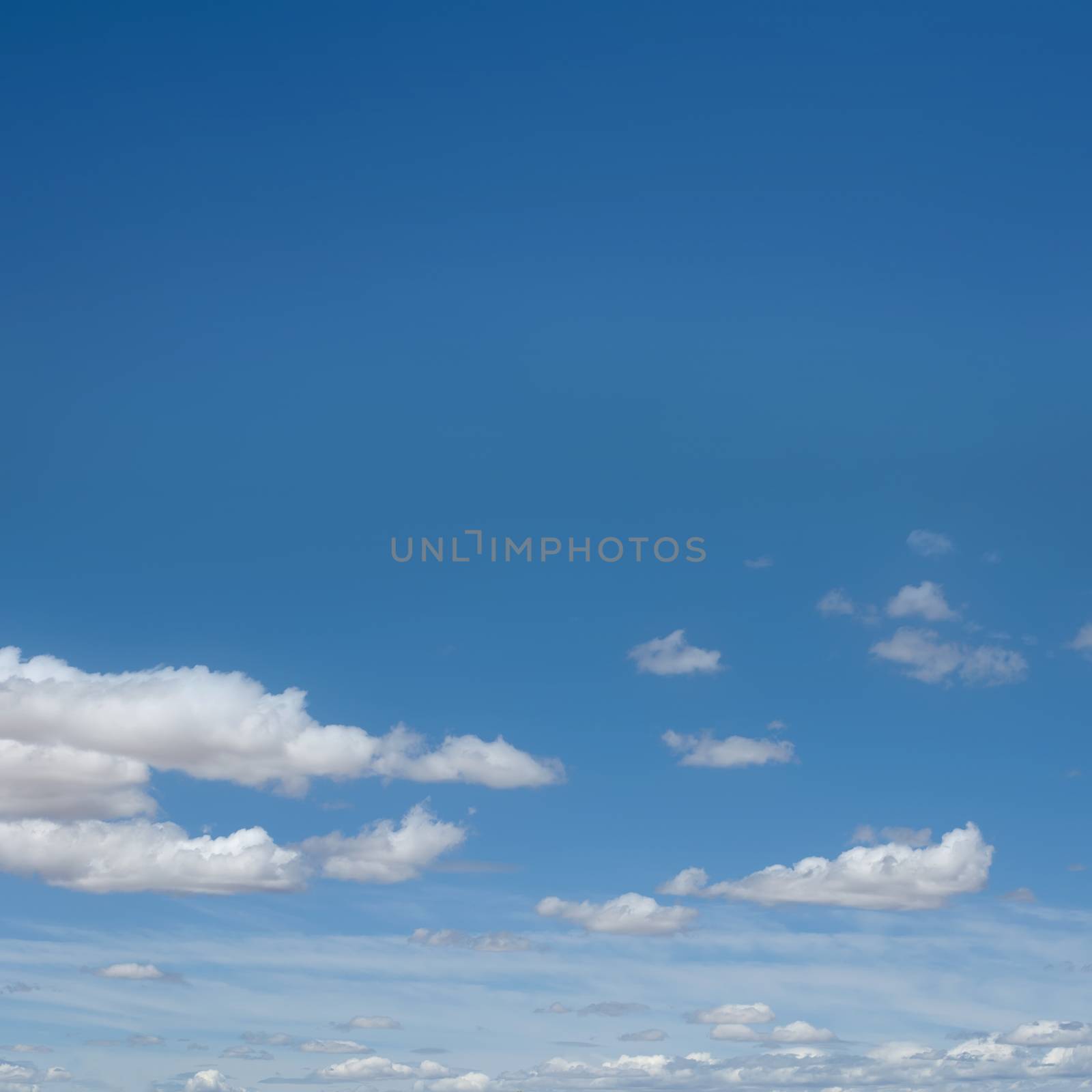 White clouds on blue sky by deyan_georgiev