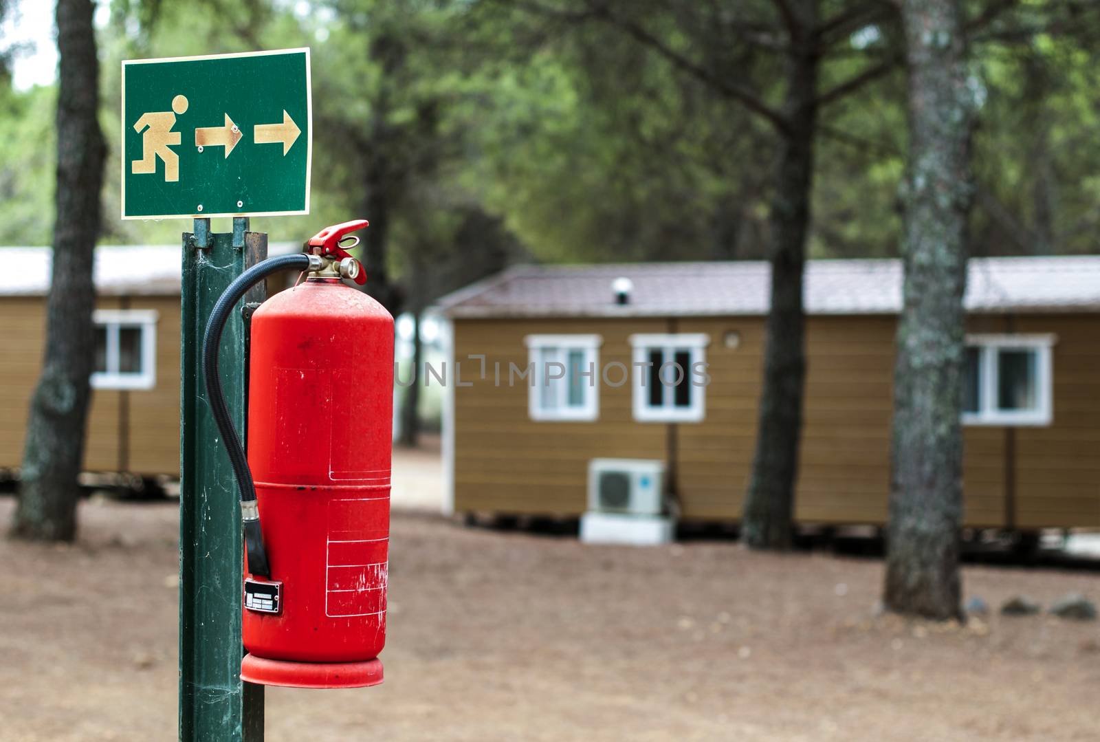 Red fire extinguisher and mobile homes. Fire safety