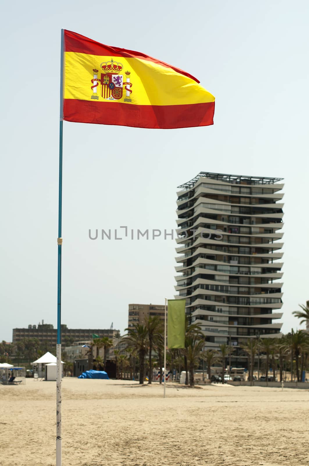 Spanish coastal resort and spanish flag