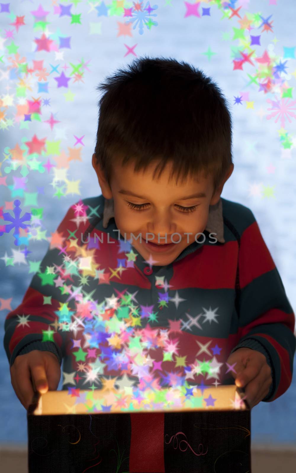 Child peeping in a gift fancy box