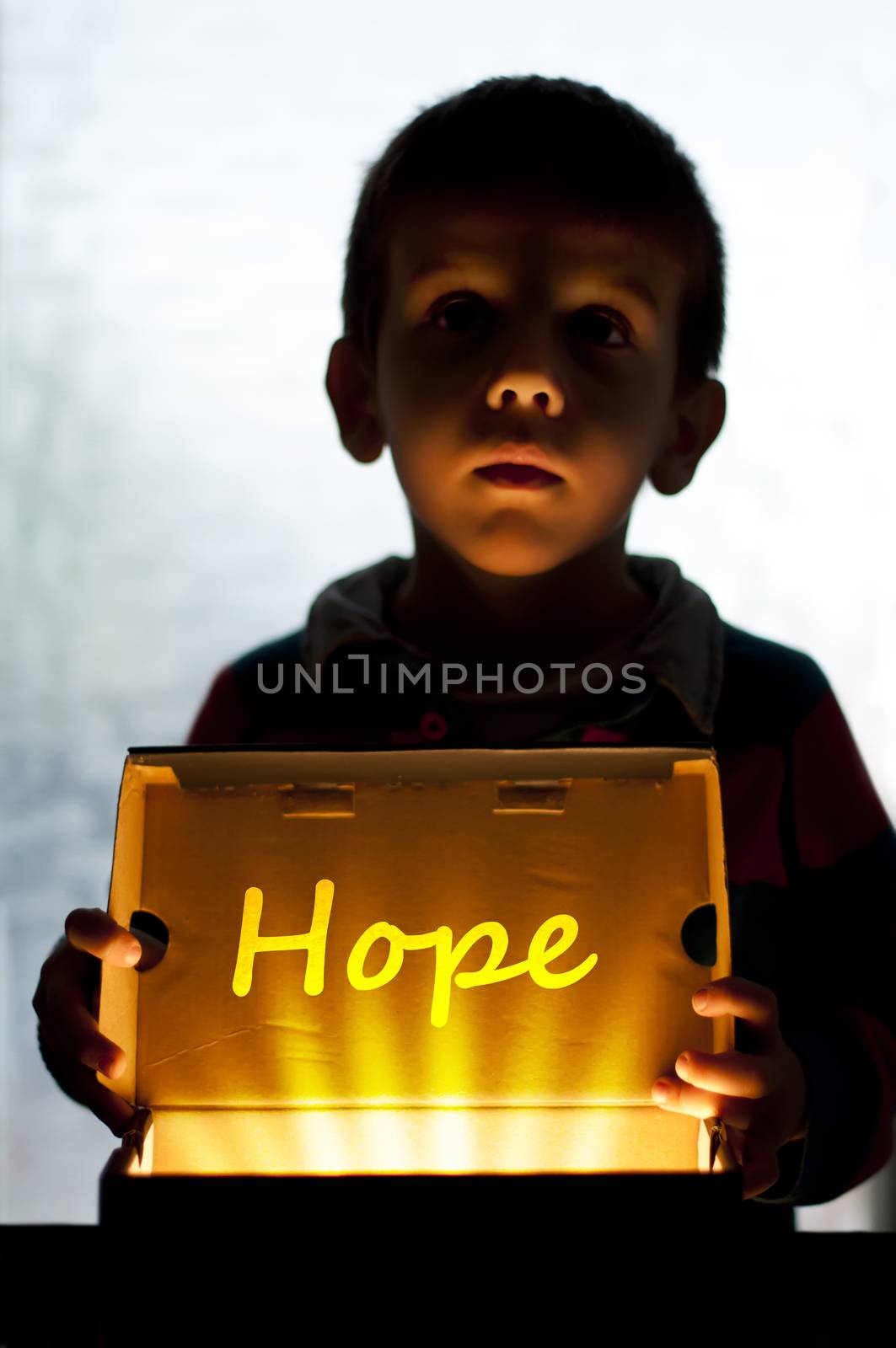 Child and box shine light. Call for help and hope. Help me