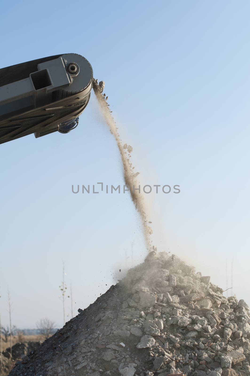 Machine for crushing stone. Falling rocks