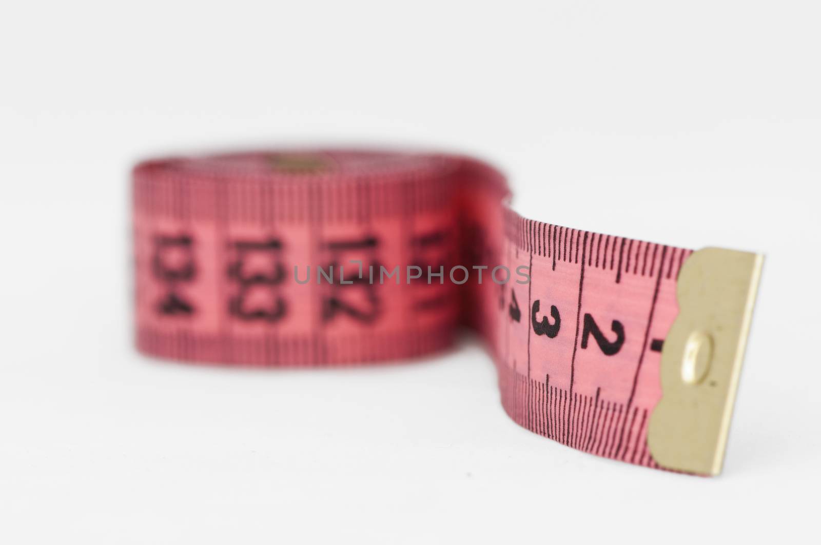 Pink tape Measure. White isolated