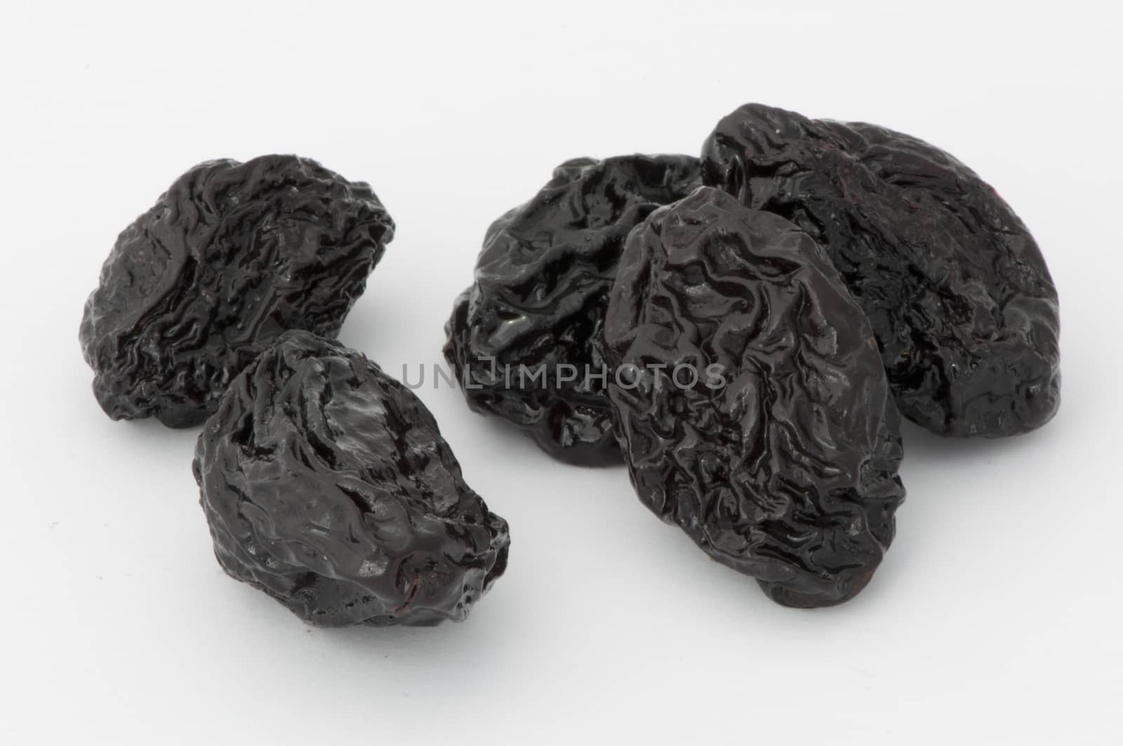 Prunes on a white background