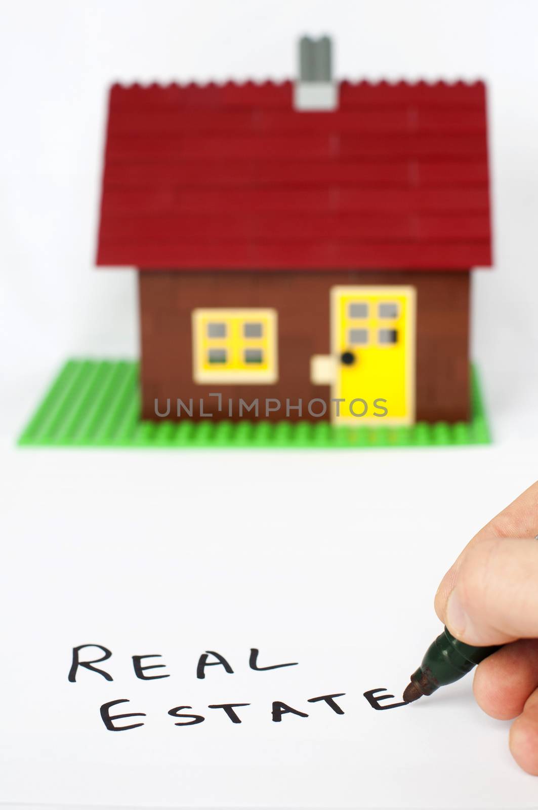 Text real estate and house on background by deyan_georgiev