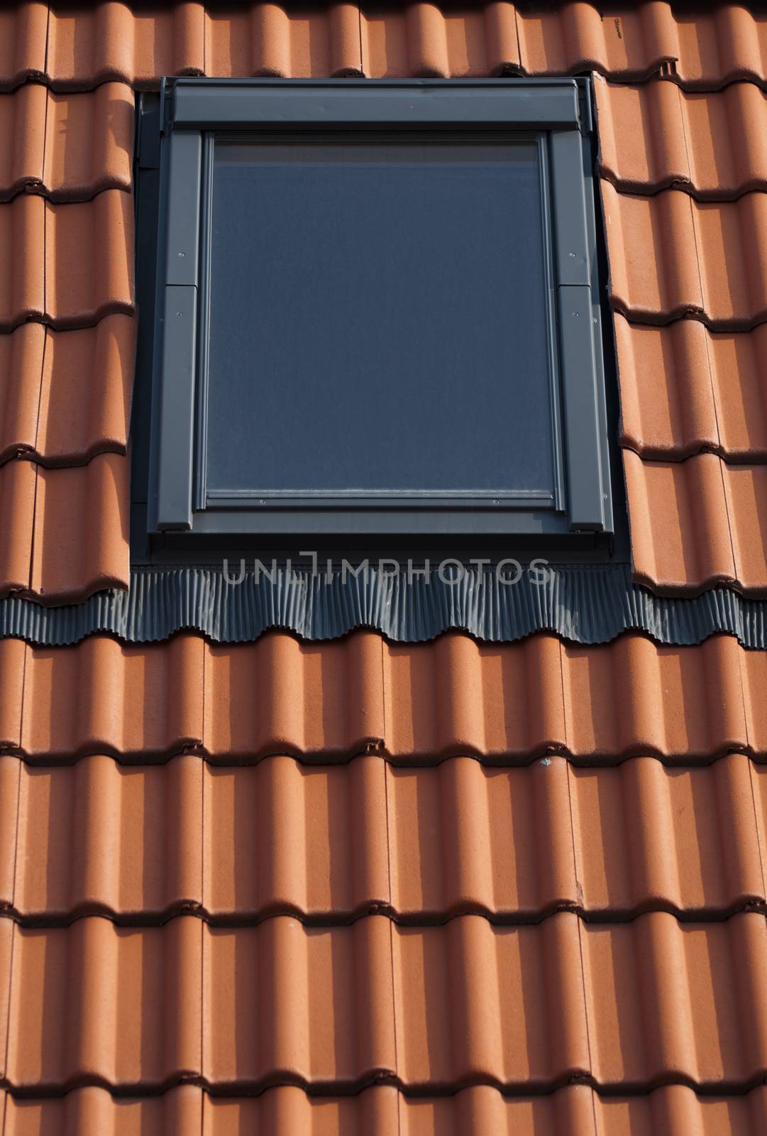 Dormer on a tiled roof by deyan_georgiev