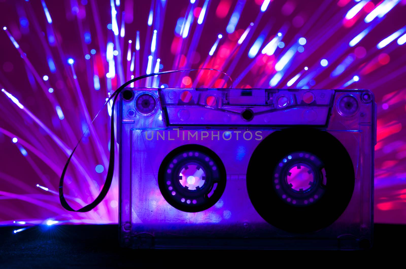 Transparent Cassette tape and disco light background by deyan_georgiev