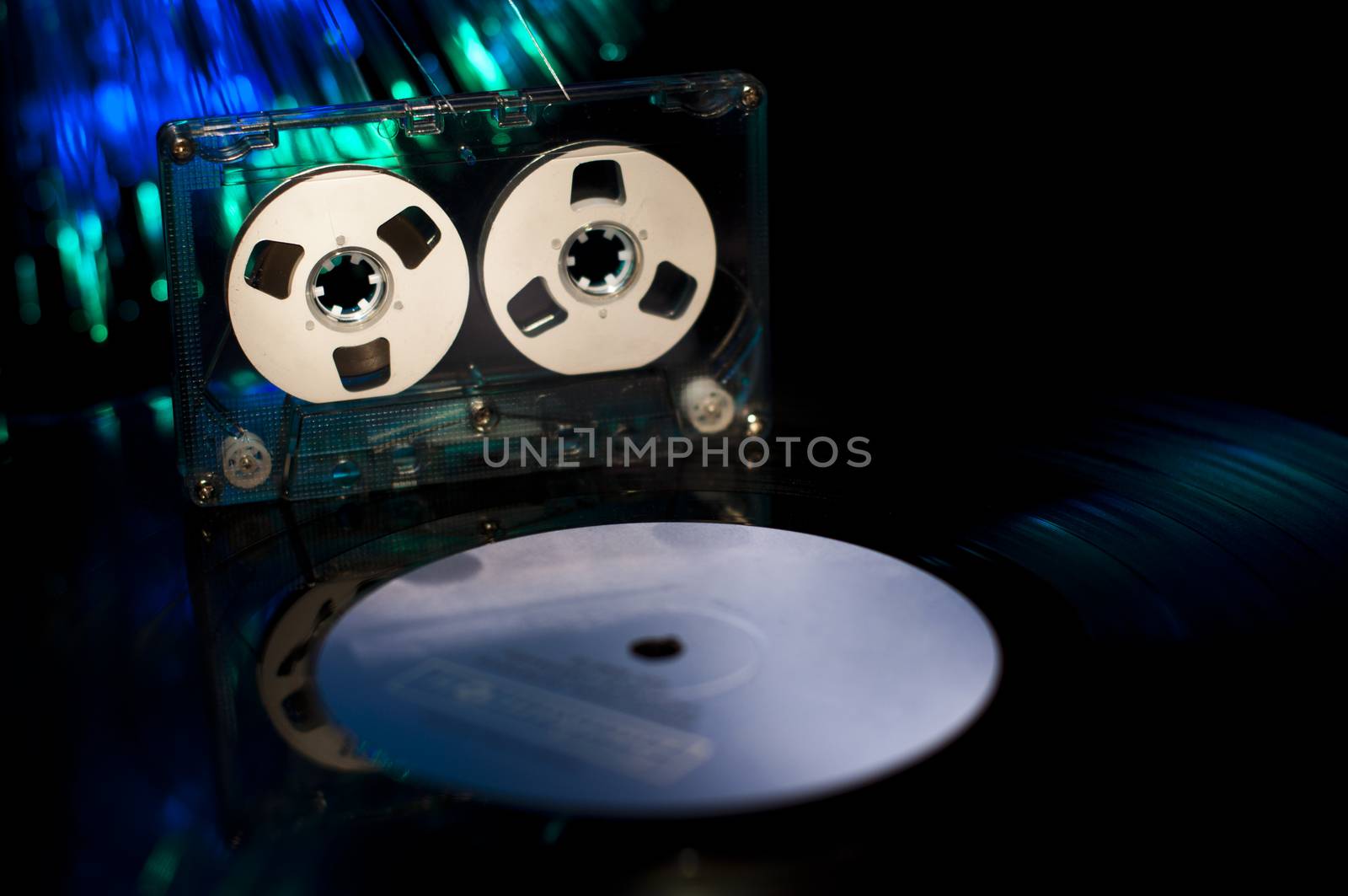 LP vinyl record, cassette tape and disco lights by deyan_georgiev