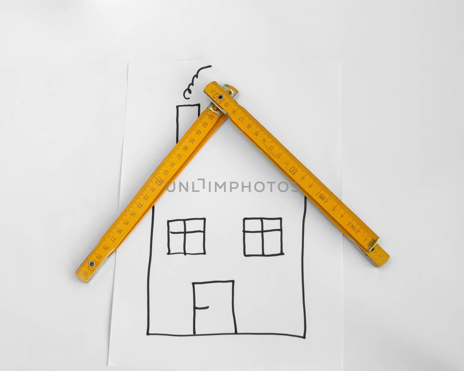 Drawed house and wooden meter for the roof