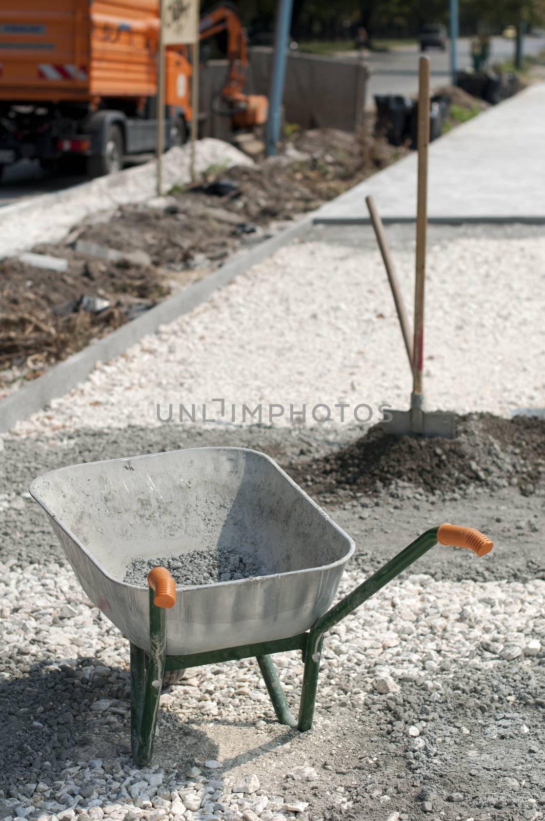 Tools for manual mixing of concrete. Bucket, shovel and wheelbarrow