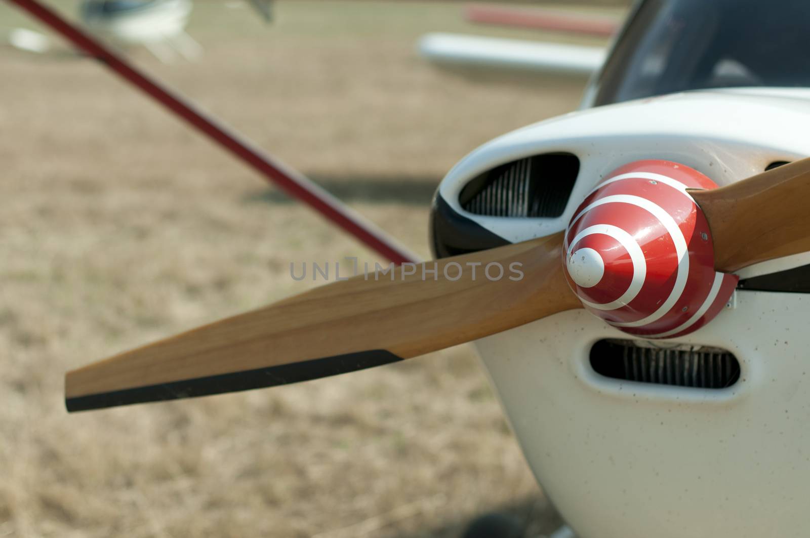 Wooden plane propeller. White plane