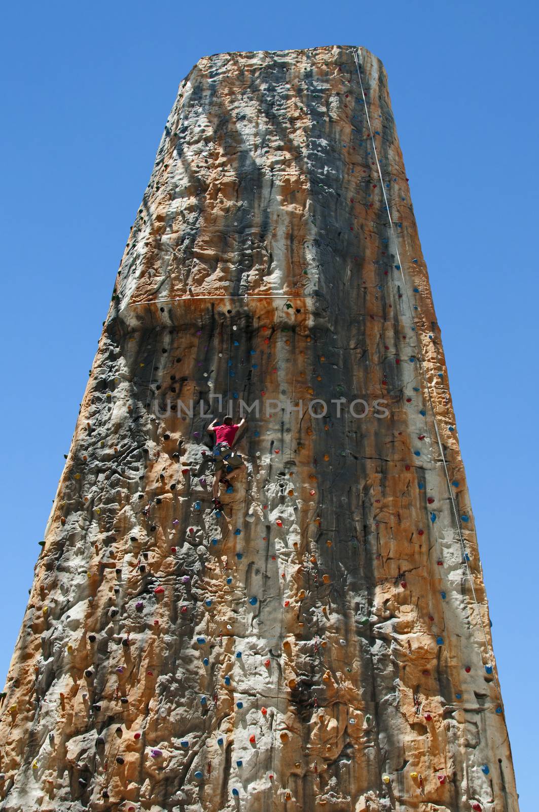 Boy on a big climbing wall by deyan_georgiev