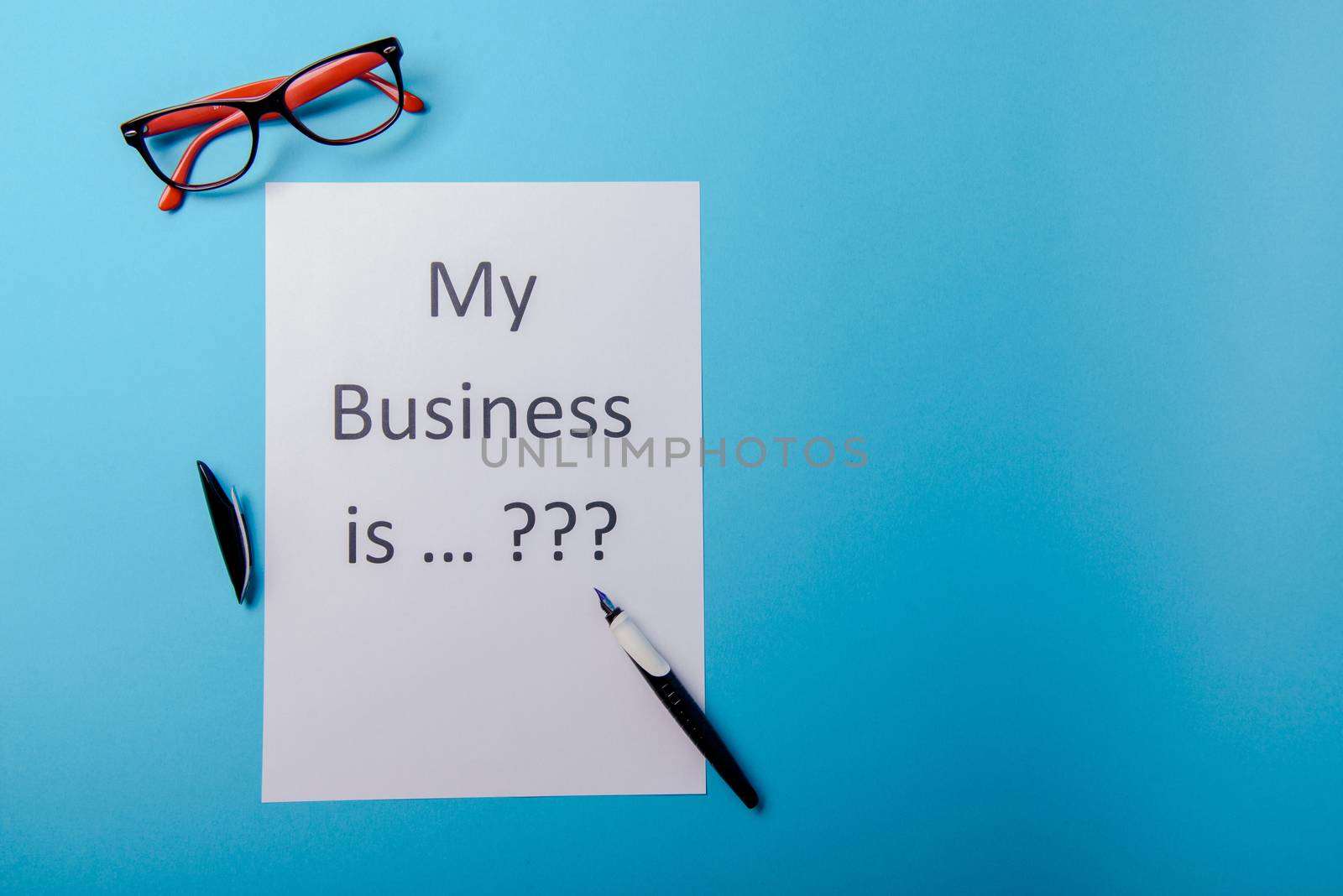 My business is word concept. Business word with business document paper on blue background. For business concept ideas background.