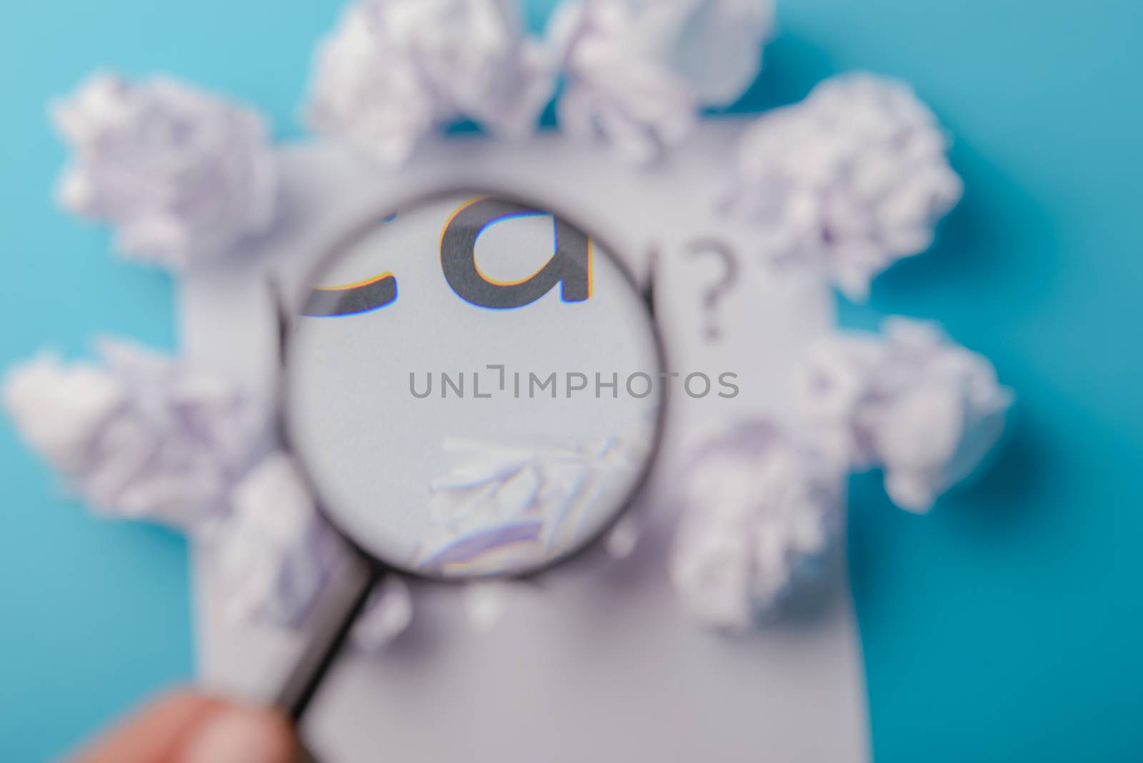 Idea word written on white paper. Blue background