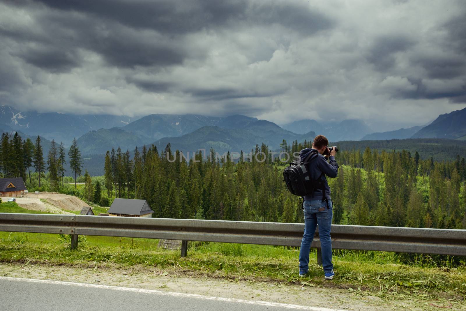 Nature photographer taking photos in the mountains.