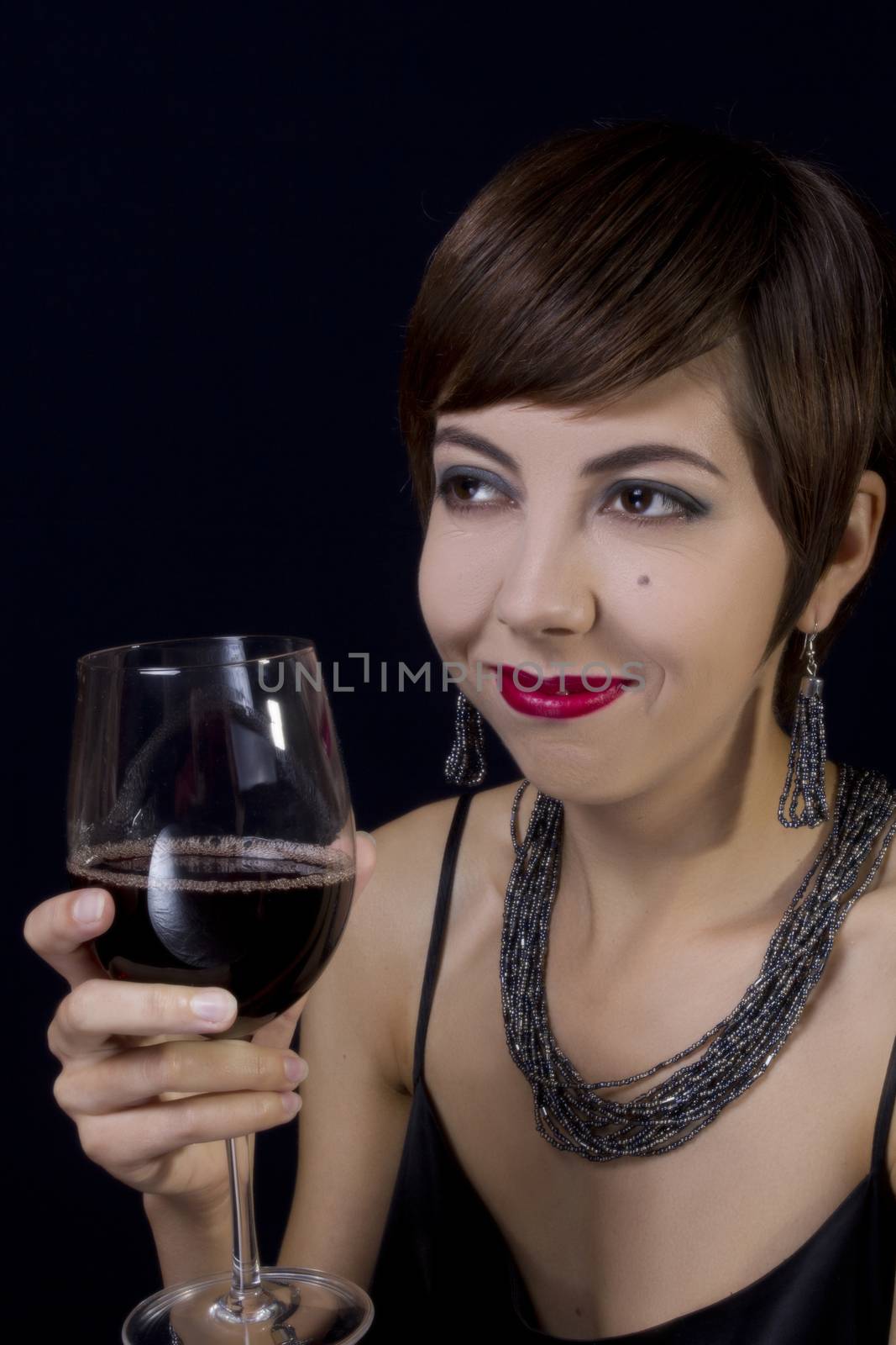 Girl in retro style with a glass of wine