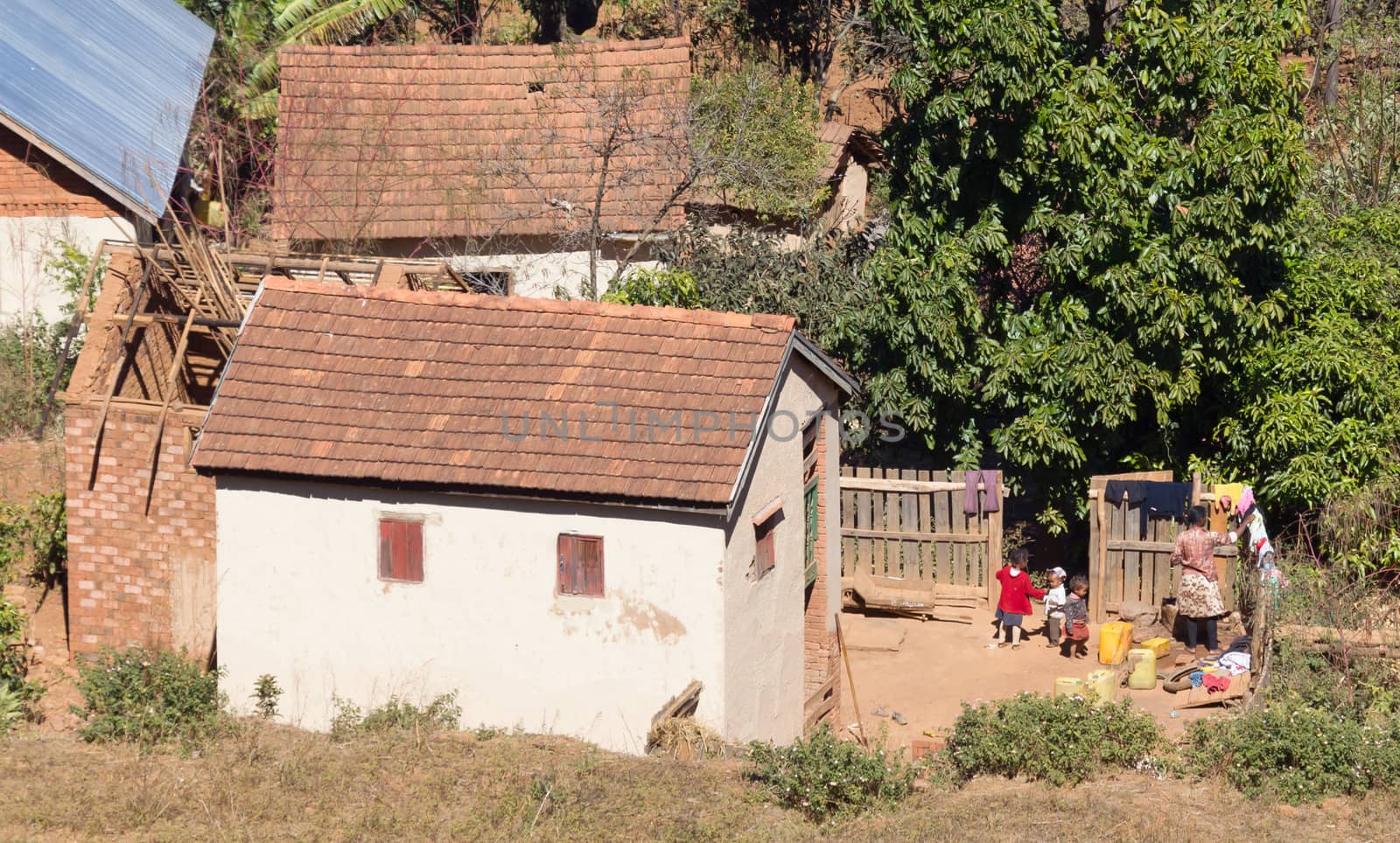 Madagascar on july 26, 2019 - Woman with children outside their house on Madagascar