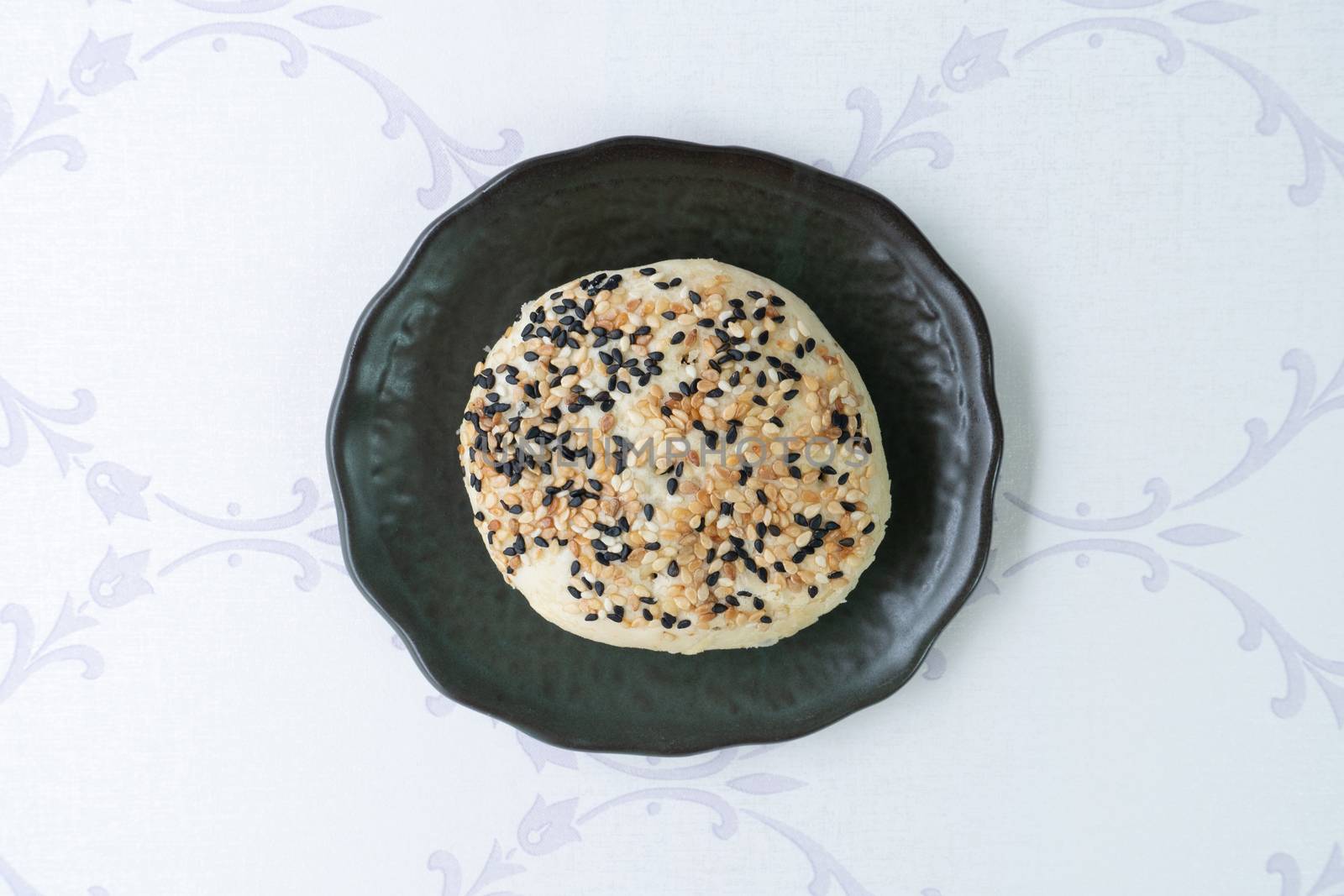 Chinese moon cake or pastry with sesame on top.