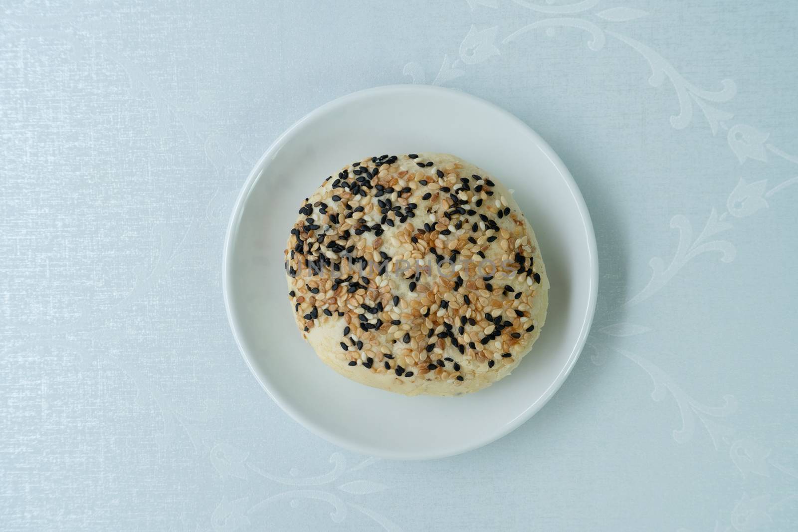 Chinese moon cake or pastry with sesame on top.
