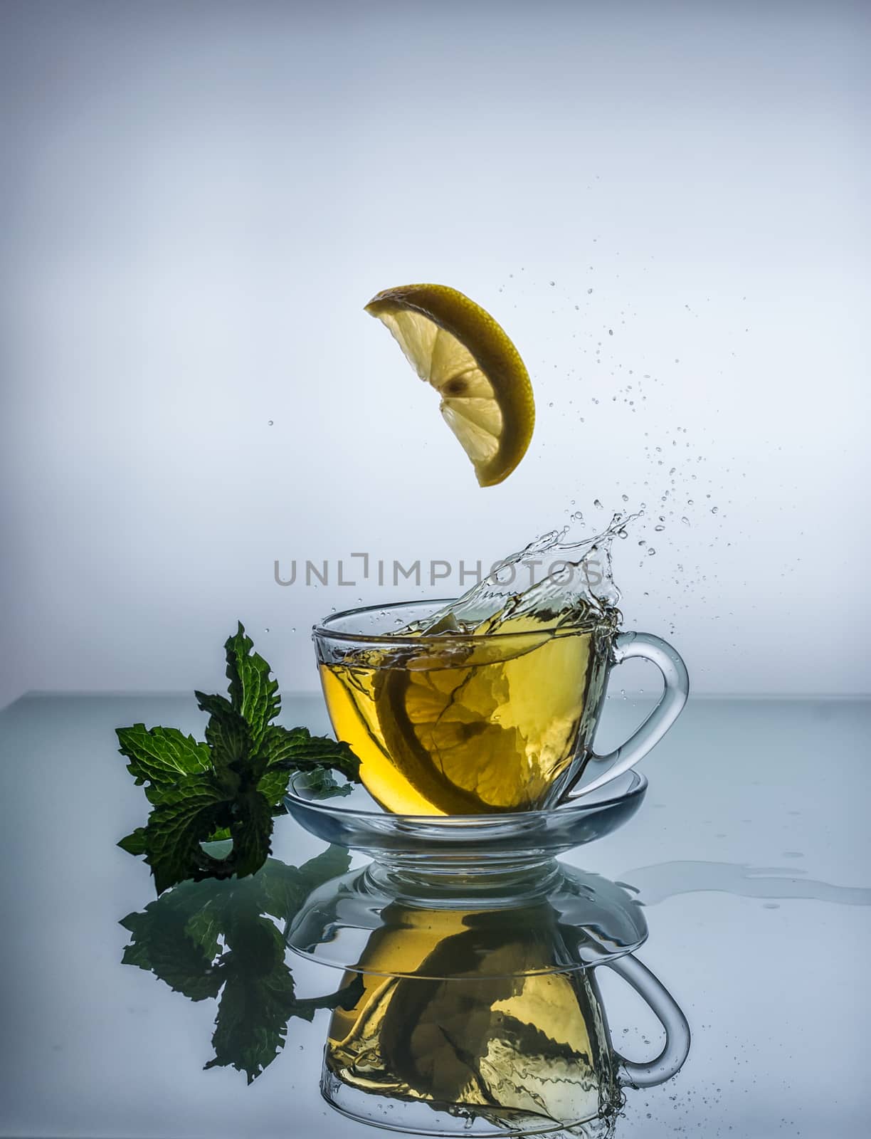 still life of Cup of tea with lemon and splash